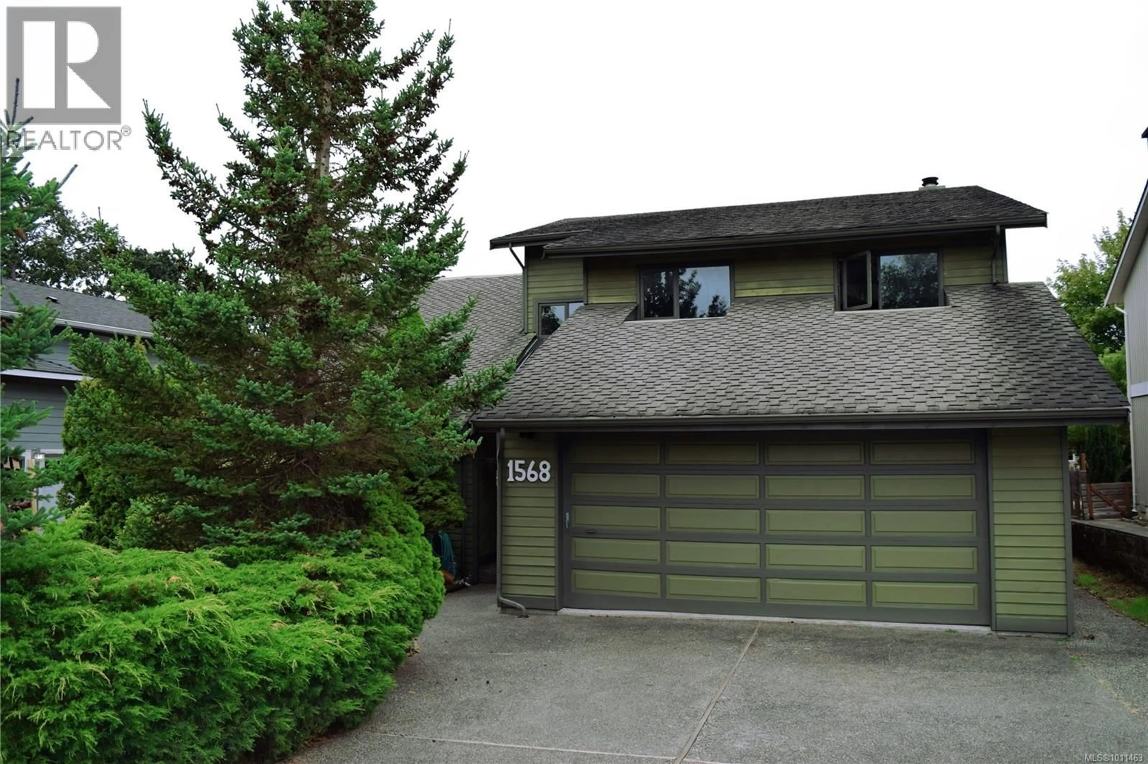 Home with vinyl exterior material, street for 1568 ERIC ROAD, Saanich British Columbia V8N5Y4