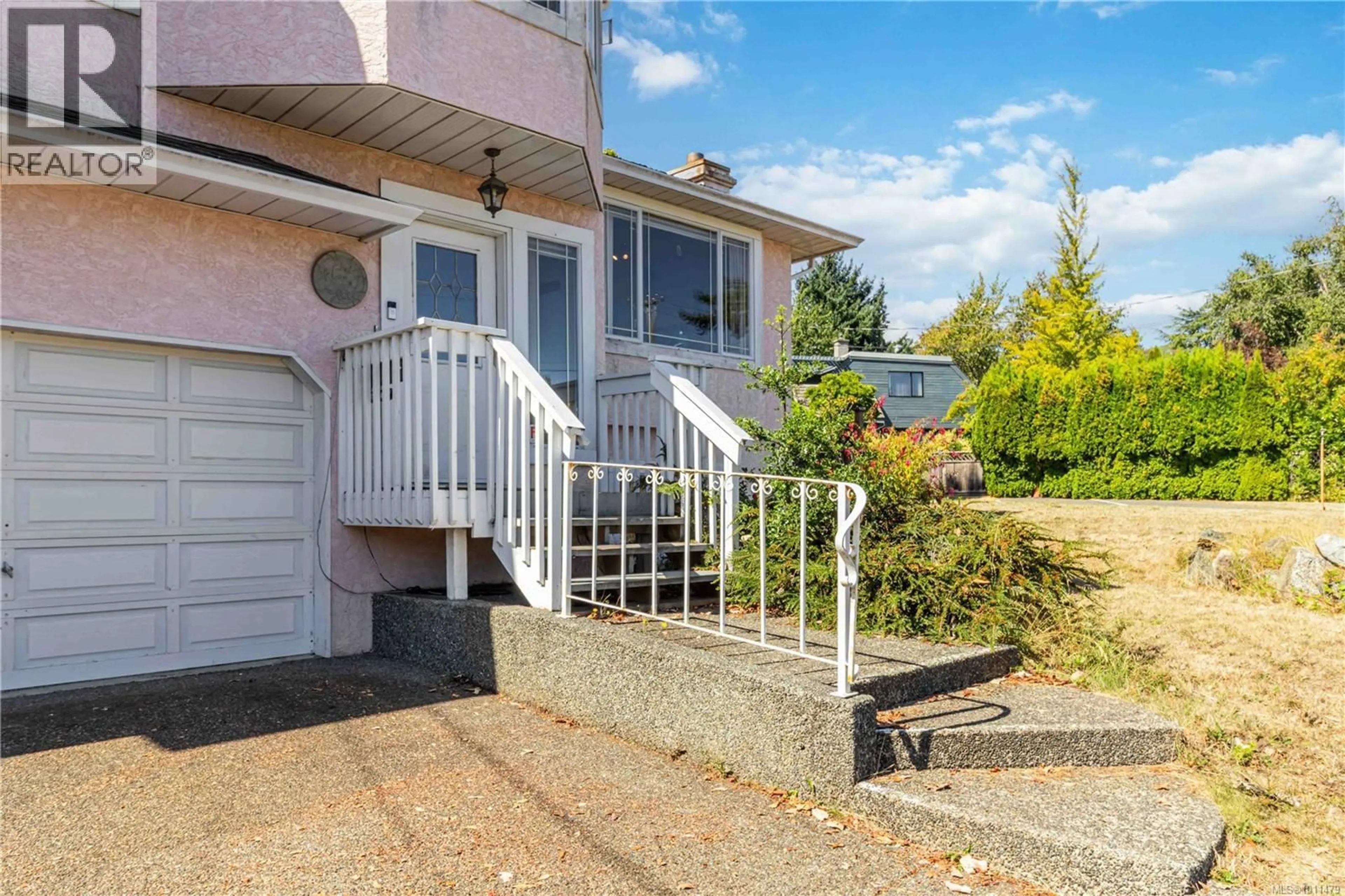 Home with vinyl exterior material, street for 2343 EDGELOW STREET, Saanich British Columbia V8N1R6