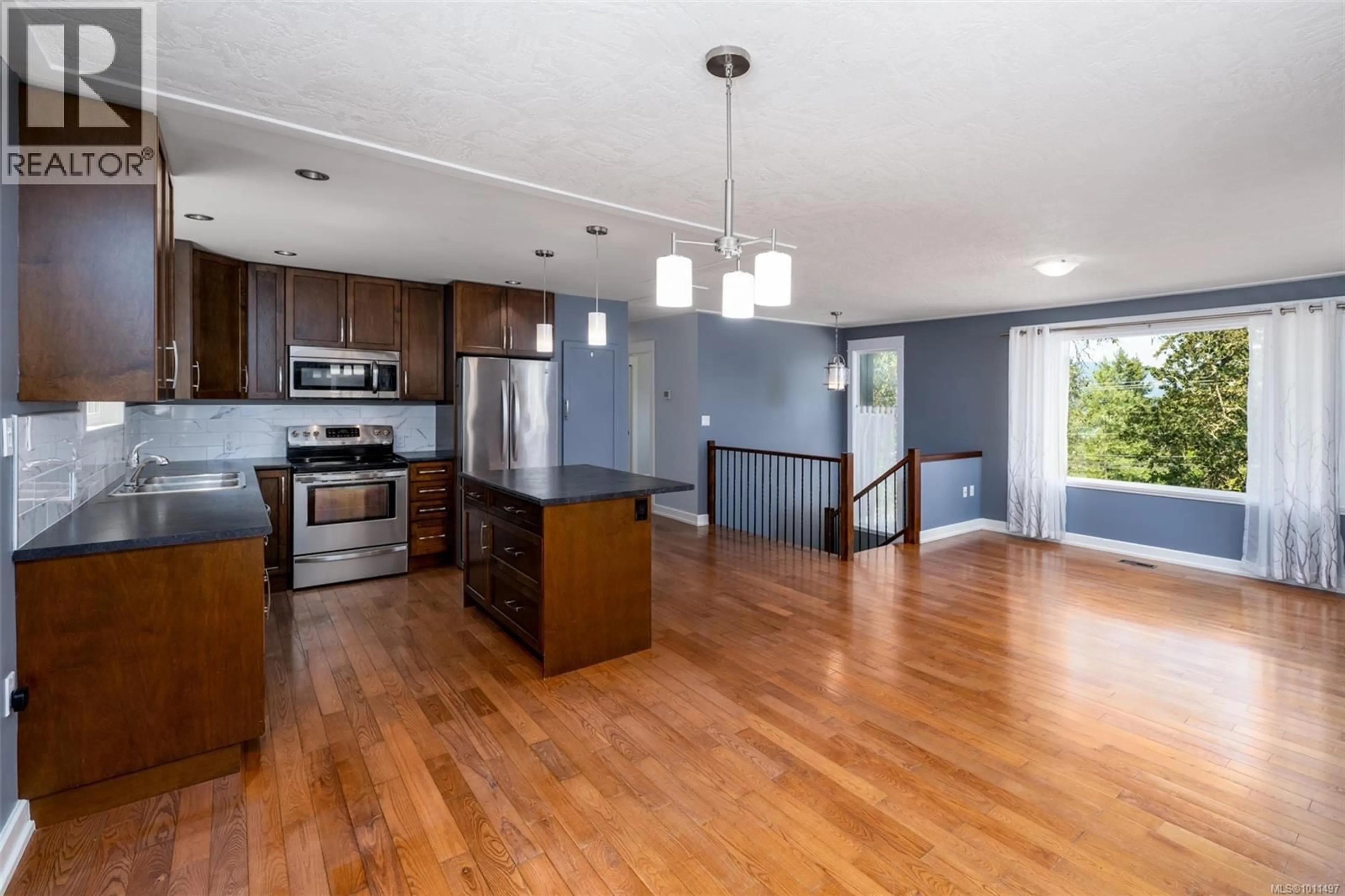 Open concept kitchen, wood/laminate floor for 1652 MAPLE BAY ROAD, Duncan British Columbia V9L5R1