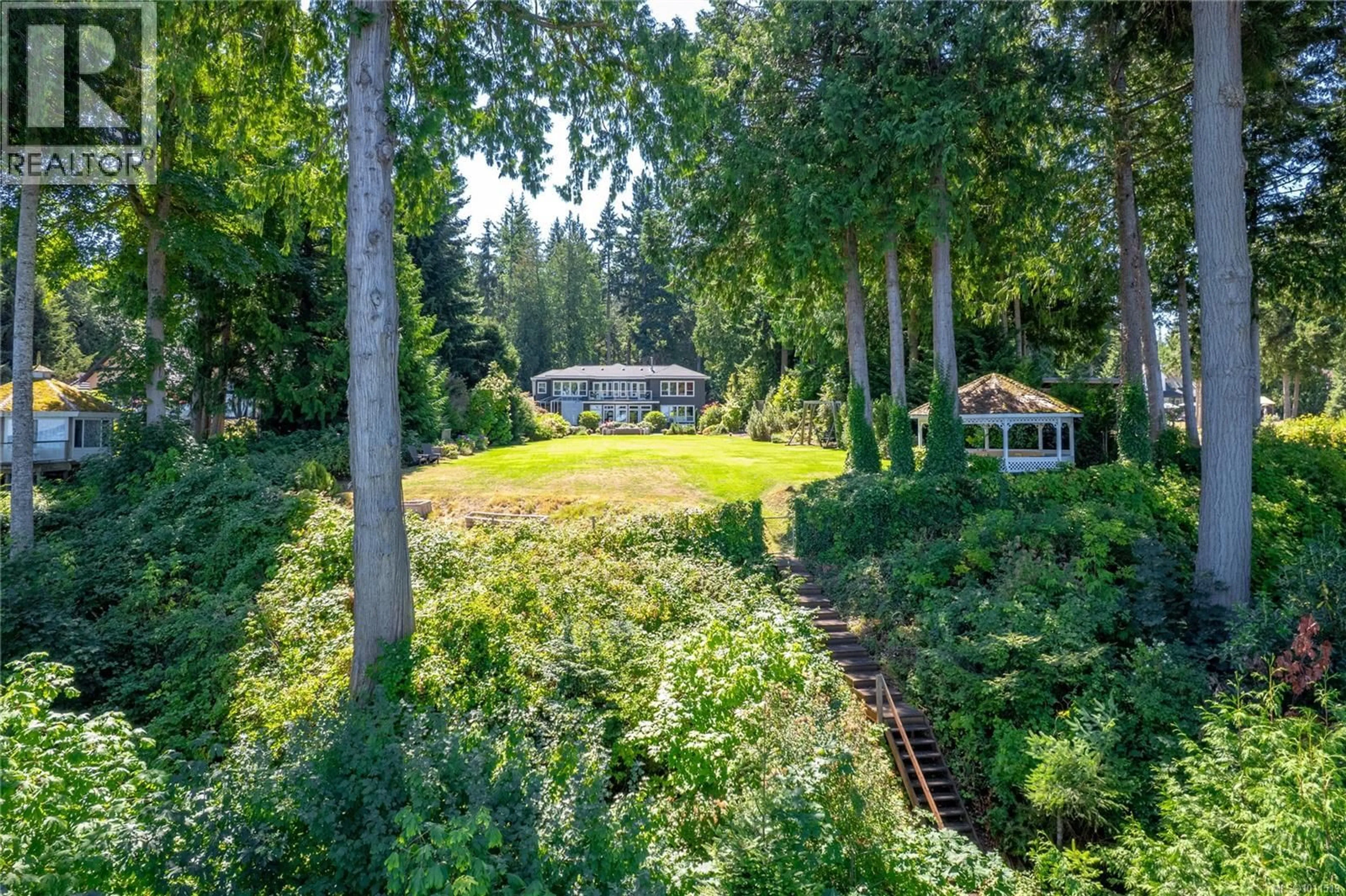 A pic from outside/outdoor area/front of a property/back of a property/a pic from drone, forest/trees view for 1895 WIDGEON ROAD, Qualicum Beach British Columbia V9K1Y8