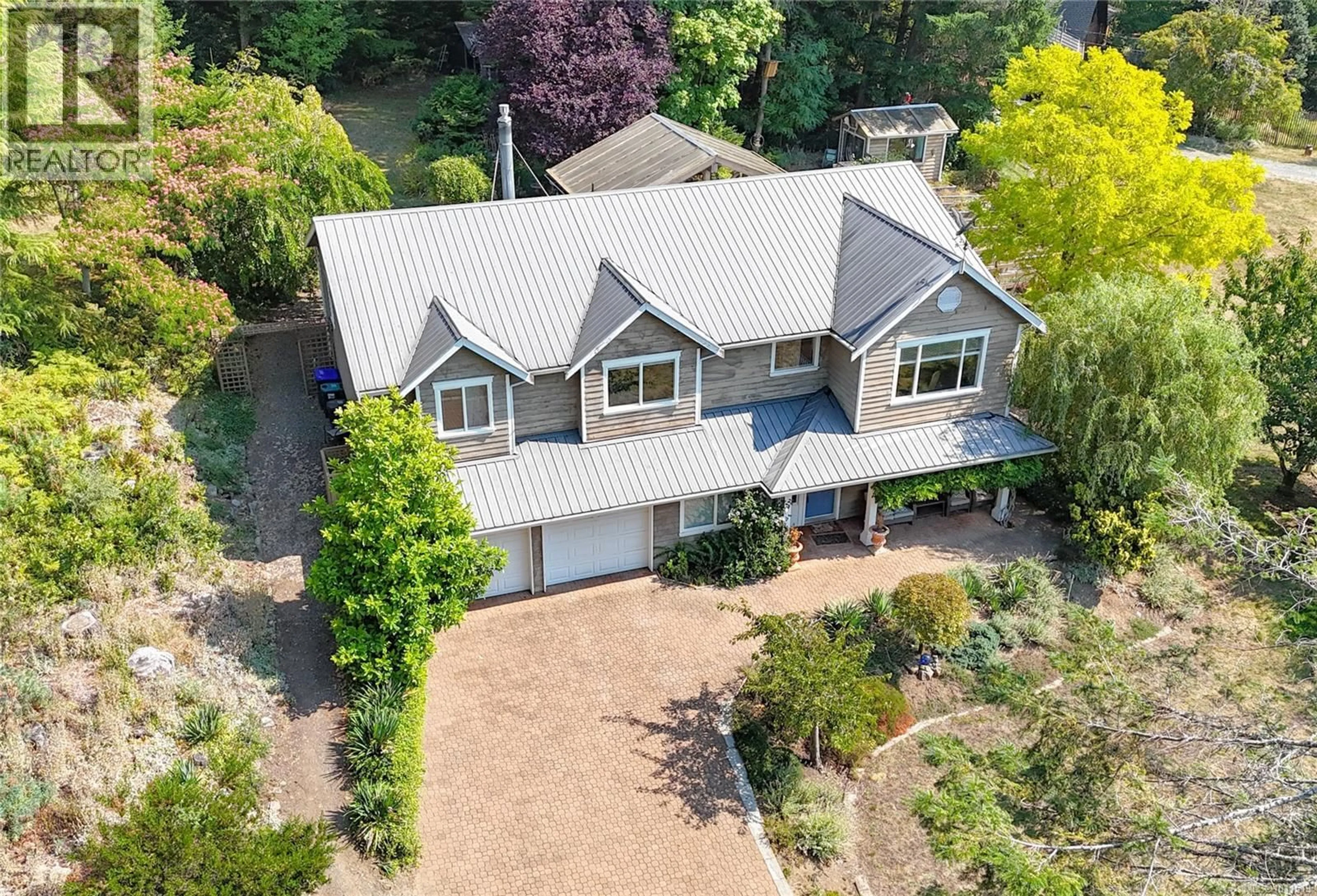 A pic from outside/outdoor area/front of a property/back of a property/a pic from drone, street for 1784 MUSSELL HEIGHTS, Gabriola Island British Columbia V0R1X6