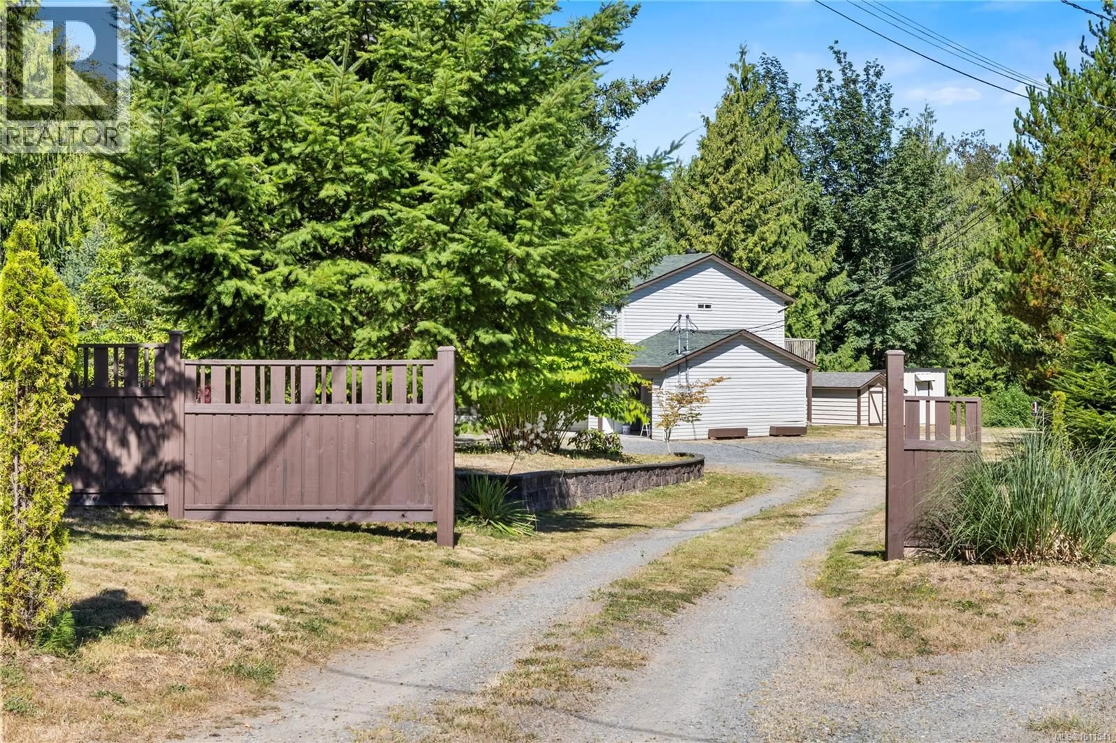 A pic from outside/outdoor area/front of a property/back of a property/a pic from drone, street for 1092 KOSKIMO ROAD, Qualicum Beach British Columbia V9K2R6