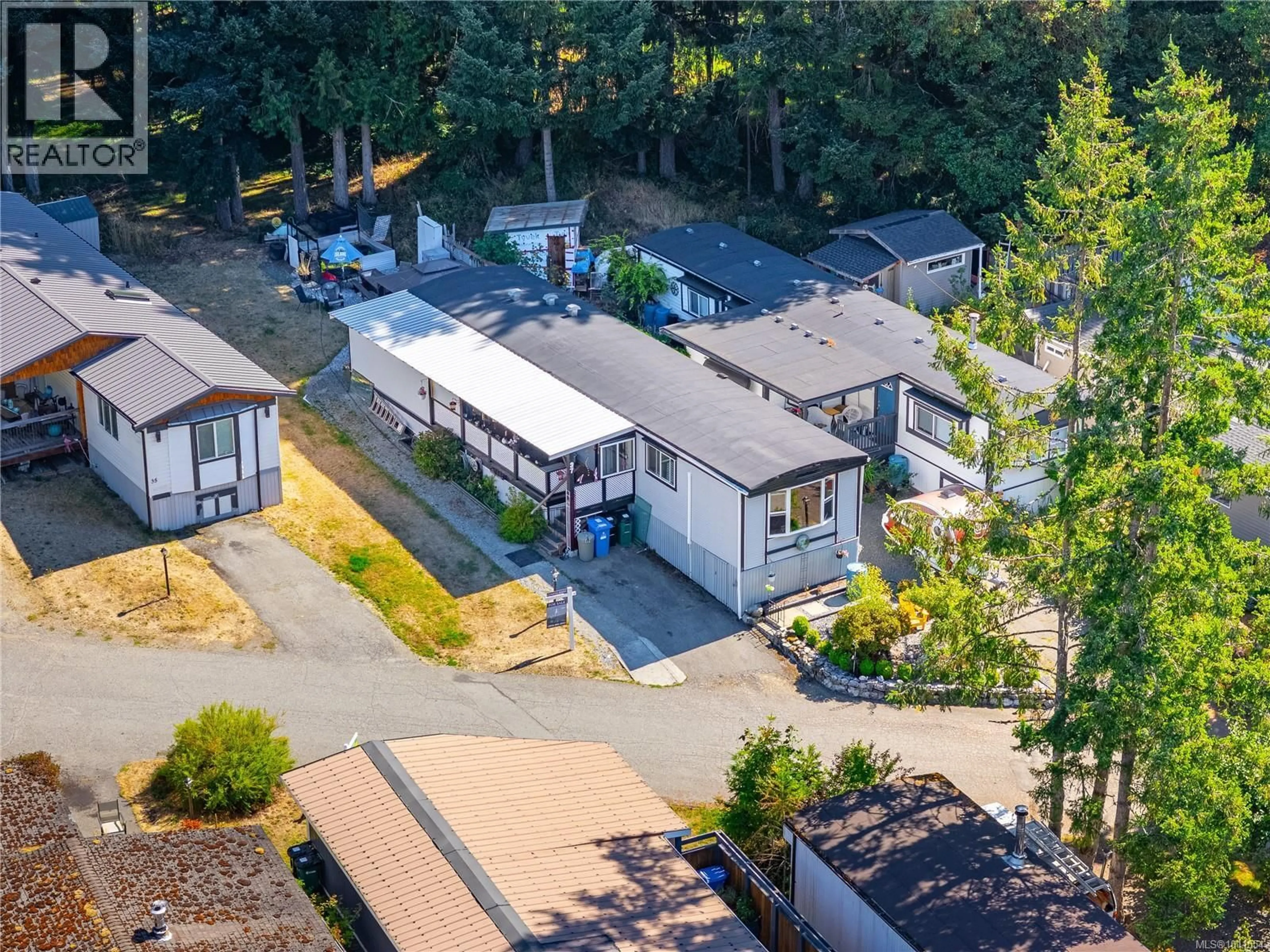 A pic from outside/outdoor area/front of a property/back of a property/a pic from drone, street for 37 - 2785 WALLBANK ROAD, Shawnigan Lake British Columbia V8H2A5