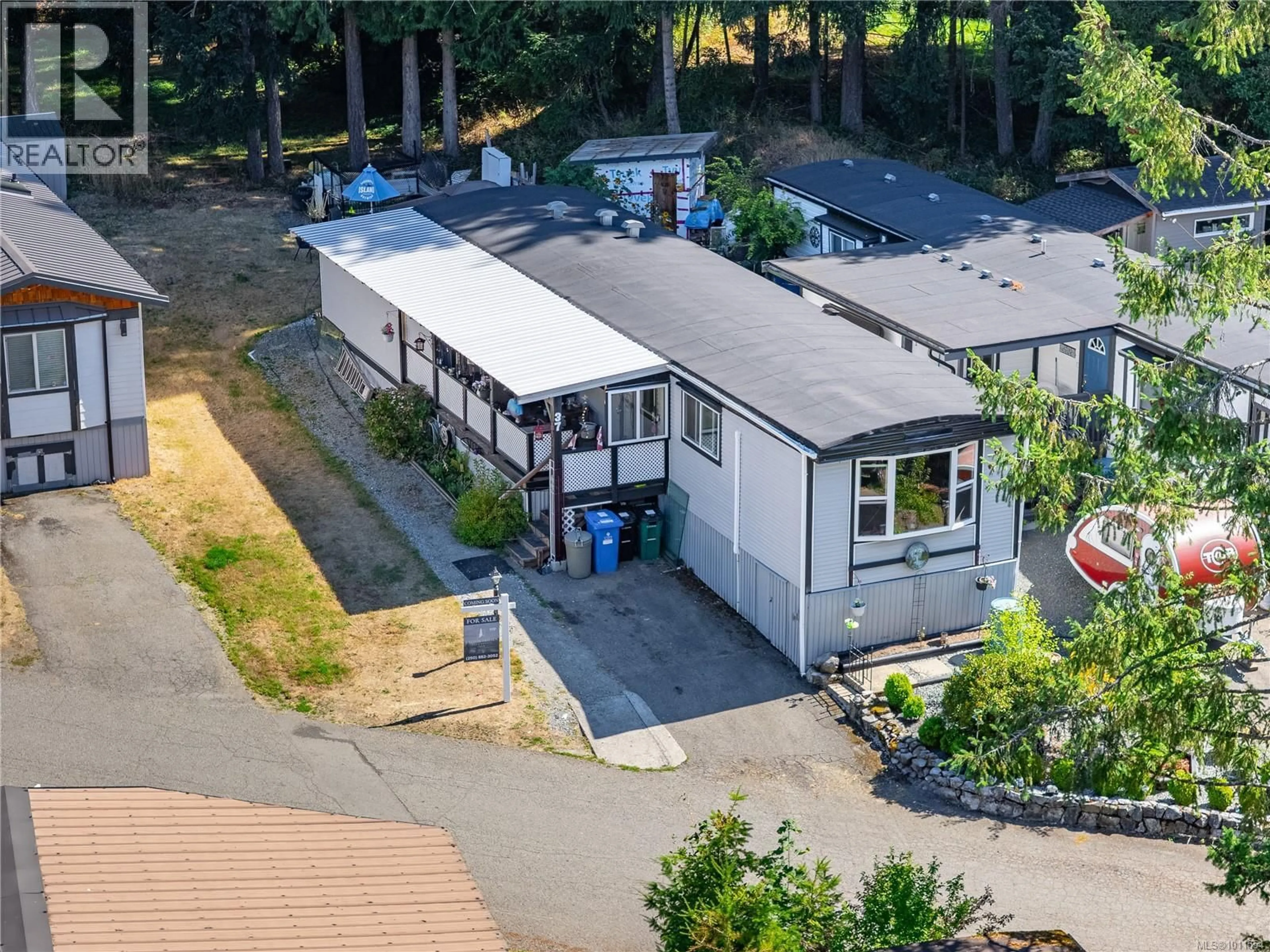 A pic from outside/outdoor area/front of a property/back of a property/a pic from drone, street for 37 - 2785 WALLBANK ROAD, Shawnigan Lake British Columbia V8H2A5