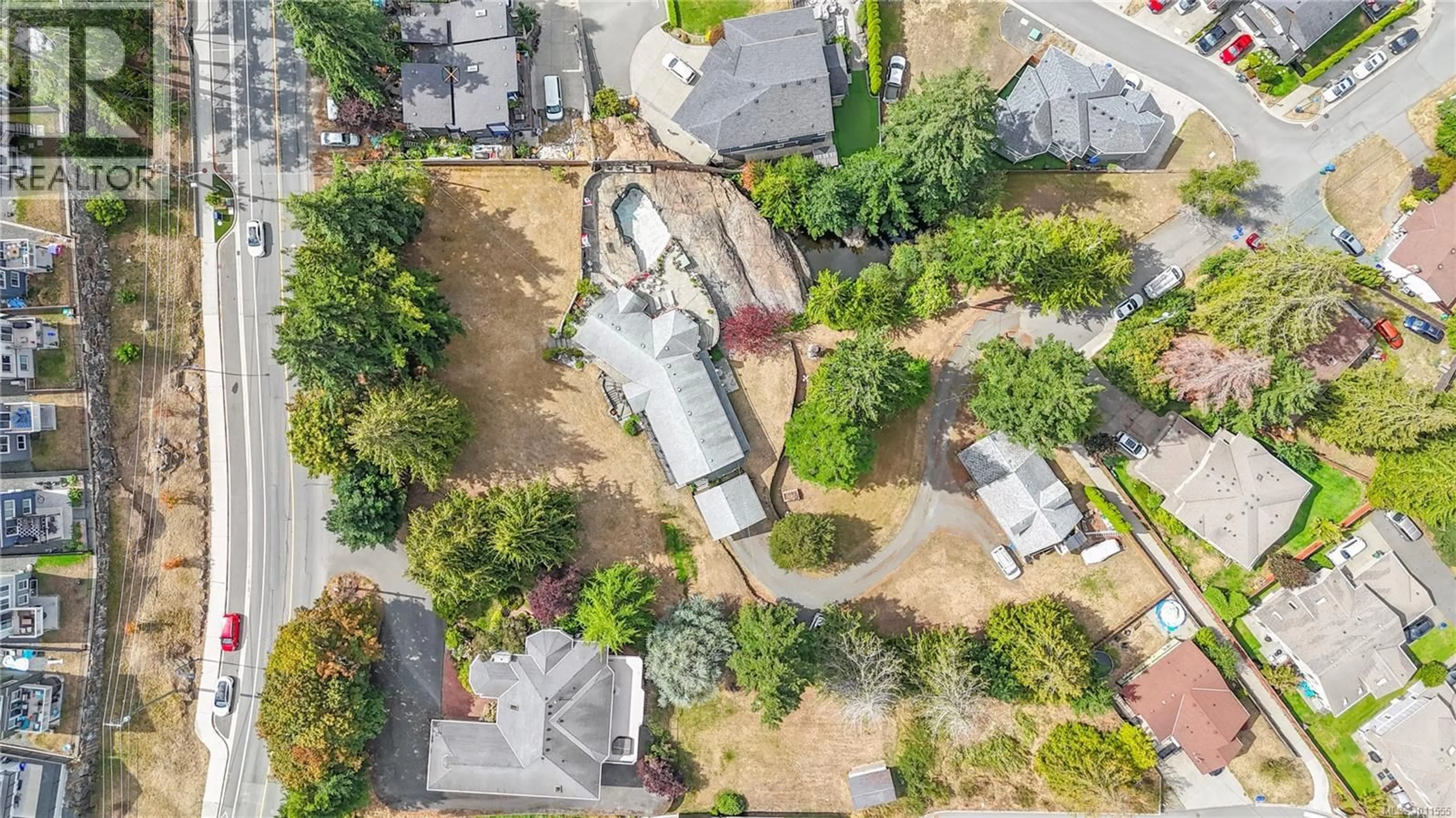 A pic from outside/outdoor area/front of a property/back of a property/a pic from drone, street for 936 WALFRED ROAD, Langford British Columbia V9C2P4