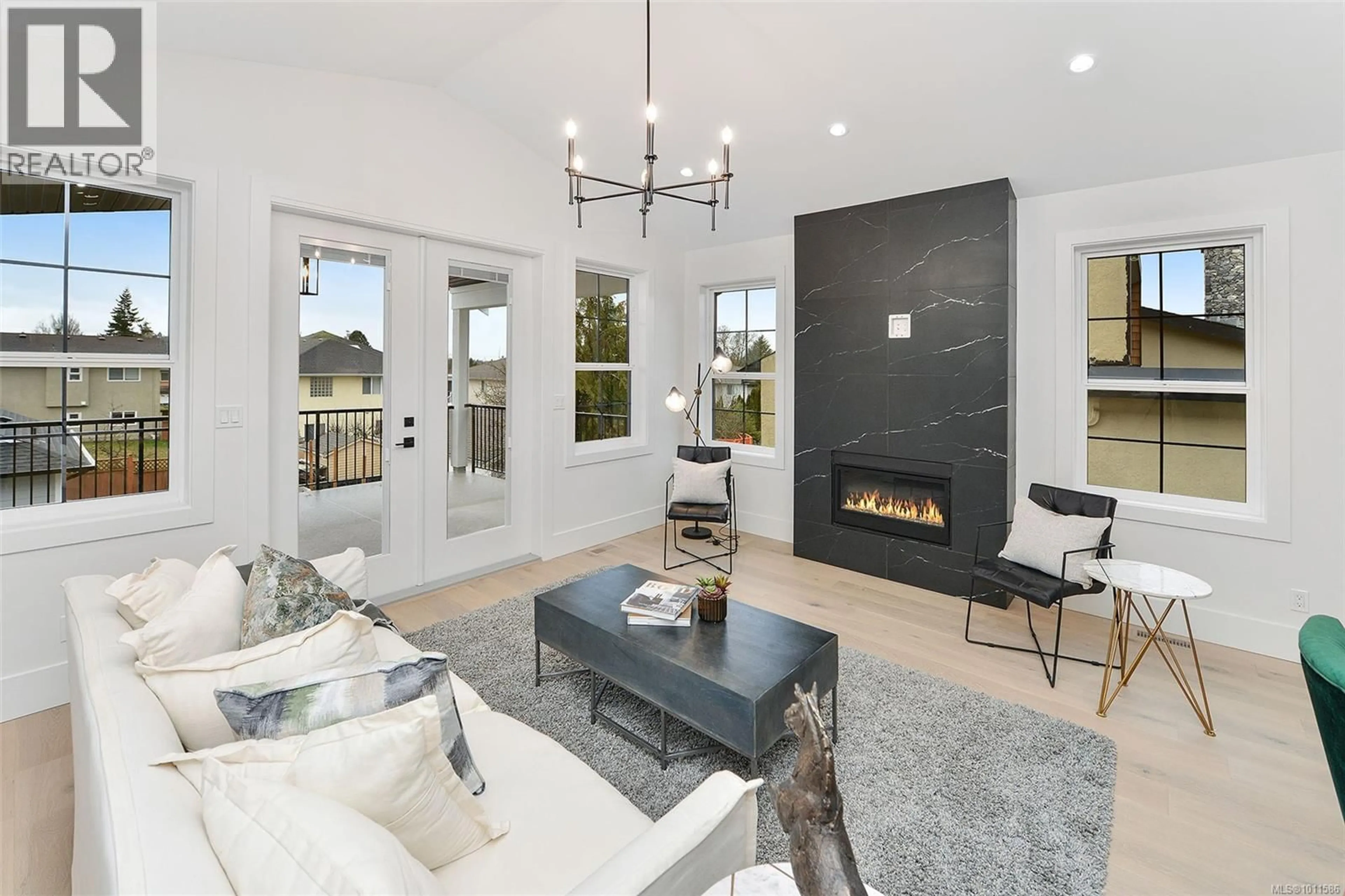 Living room with furniture, ceramic/tile floor for 1813 FELTHAM ROAD, Saanich British Columbia V8N2A4