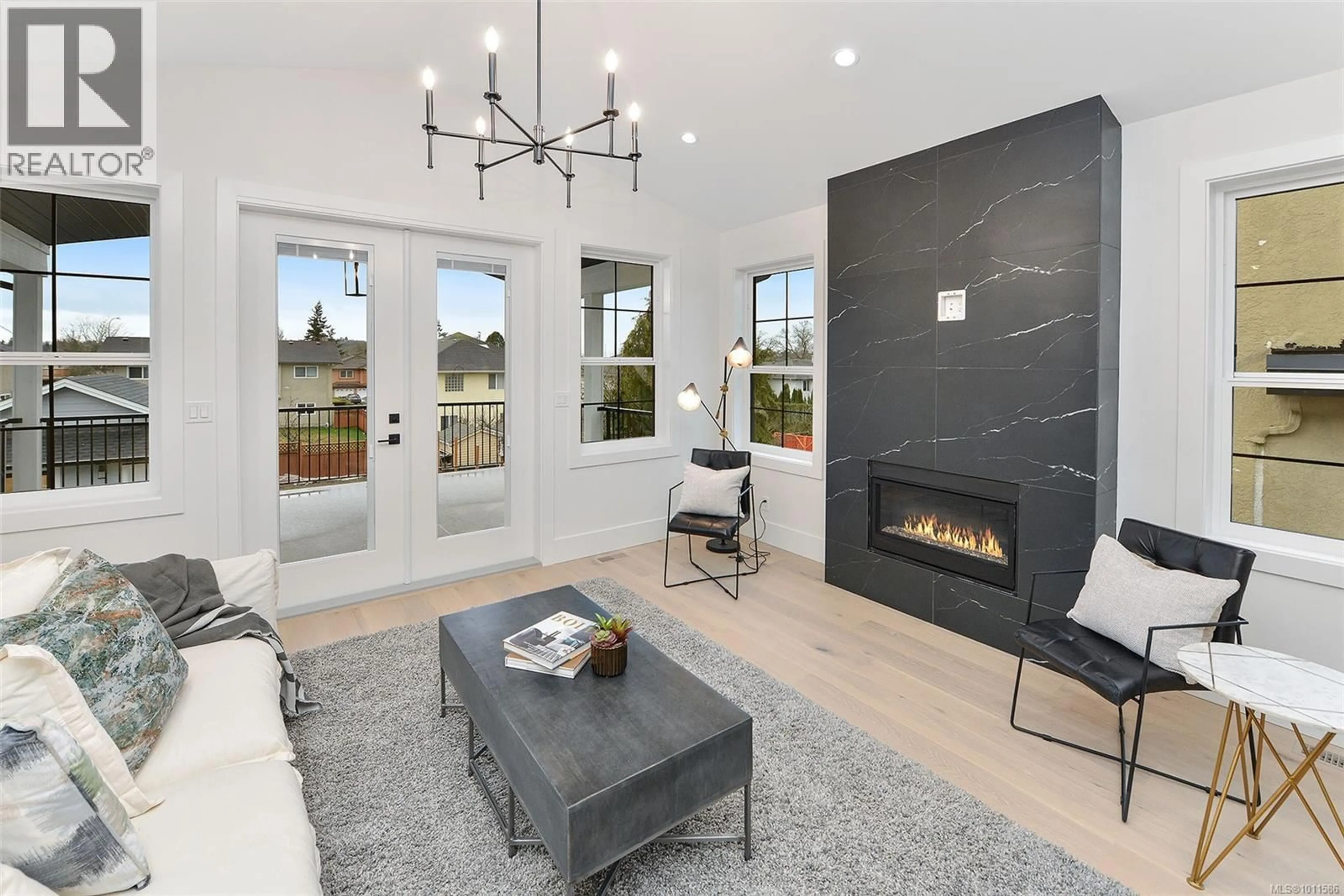 Living room with furniture, ceramic/tile floor for 1813 FELTHAM ROAD, Saanich British Columbia V8N2A4