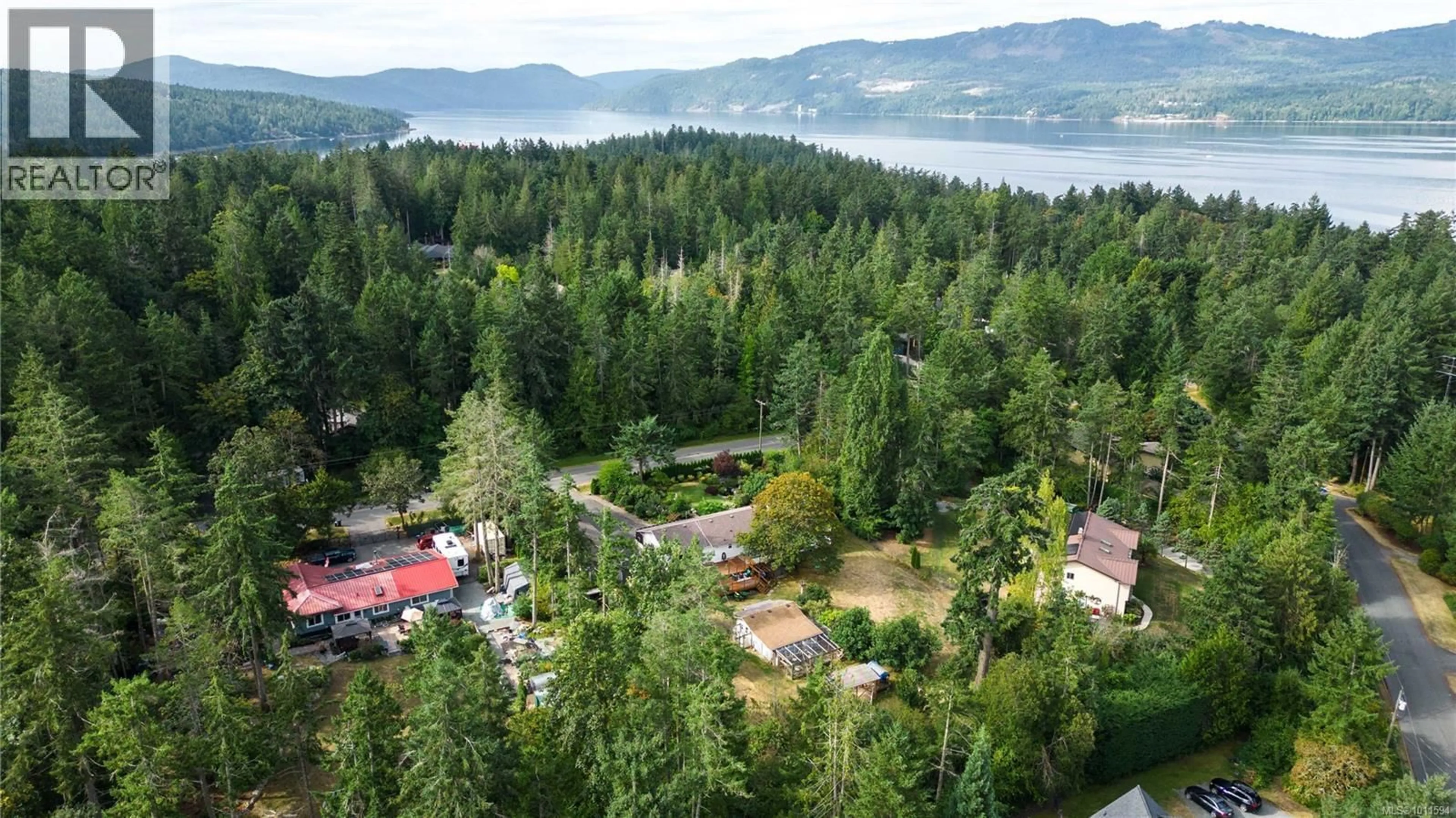 A pic from outside/outdoor area/front of a property/back of a property/a pic from drone, forest/trees view for 714 BRADLEY DYNE ROAD, North Saanich British Columbia V8L5G9