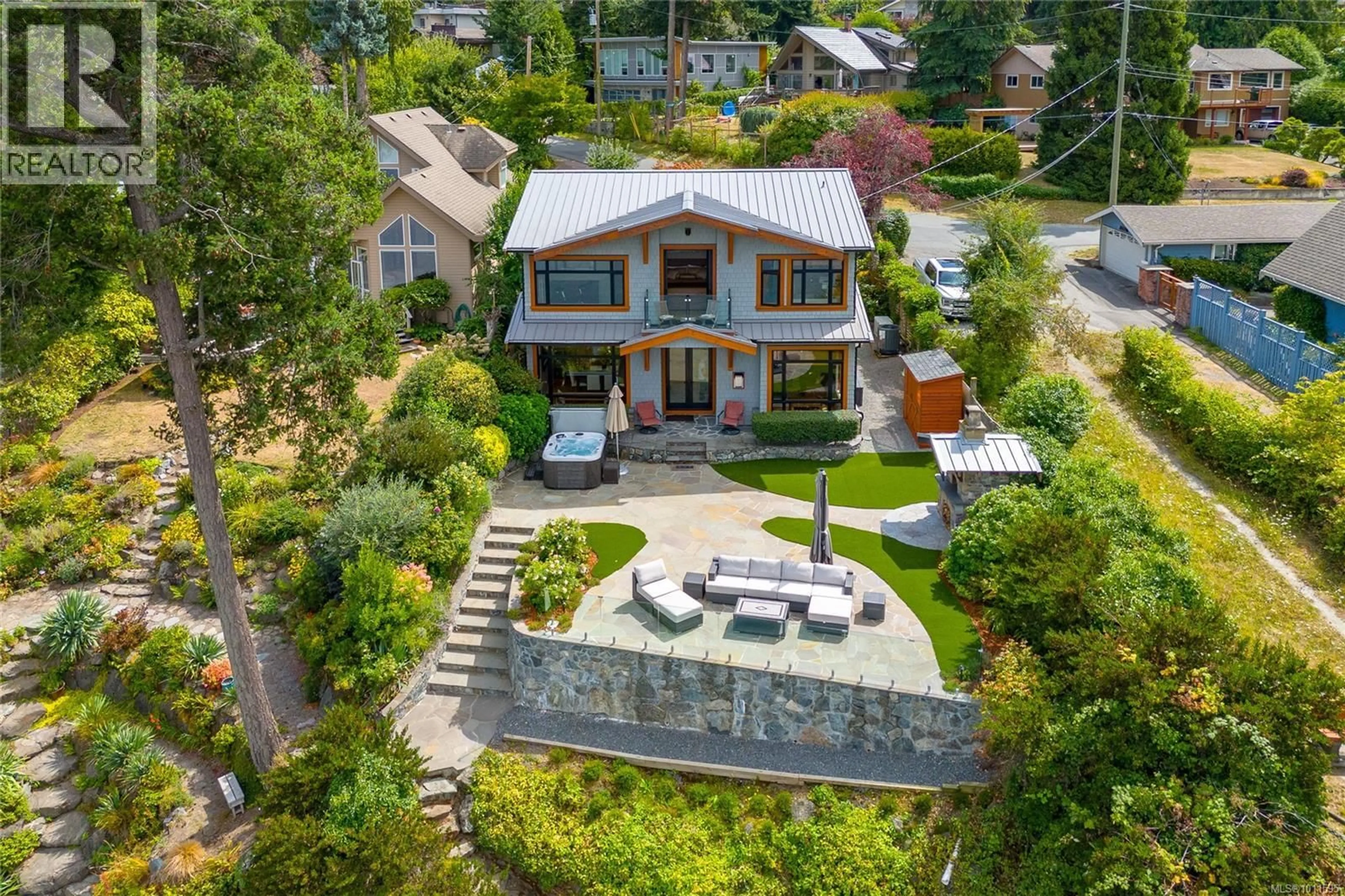 A pic from outside/outdoor area/front of a property/back of a property/a pic from drone, street for 580 MELDRAM DRIVE, North Saanich British Columbia V8L5V8