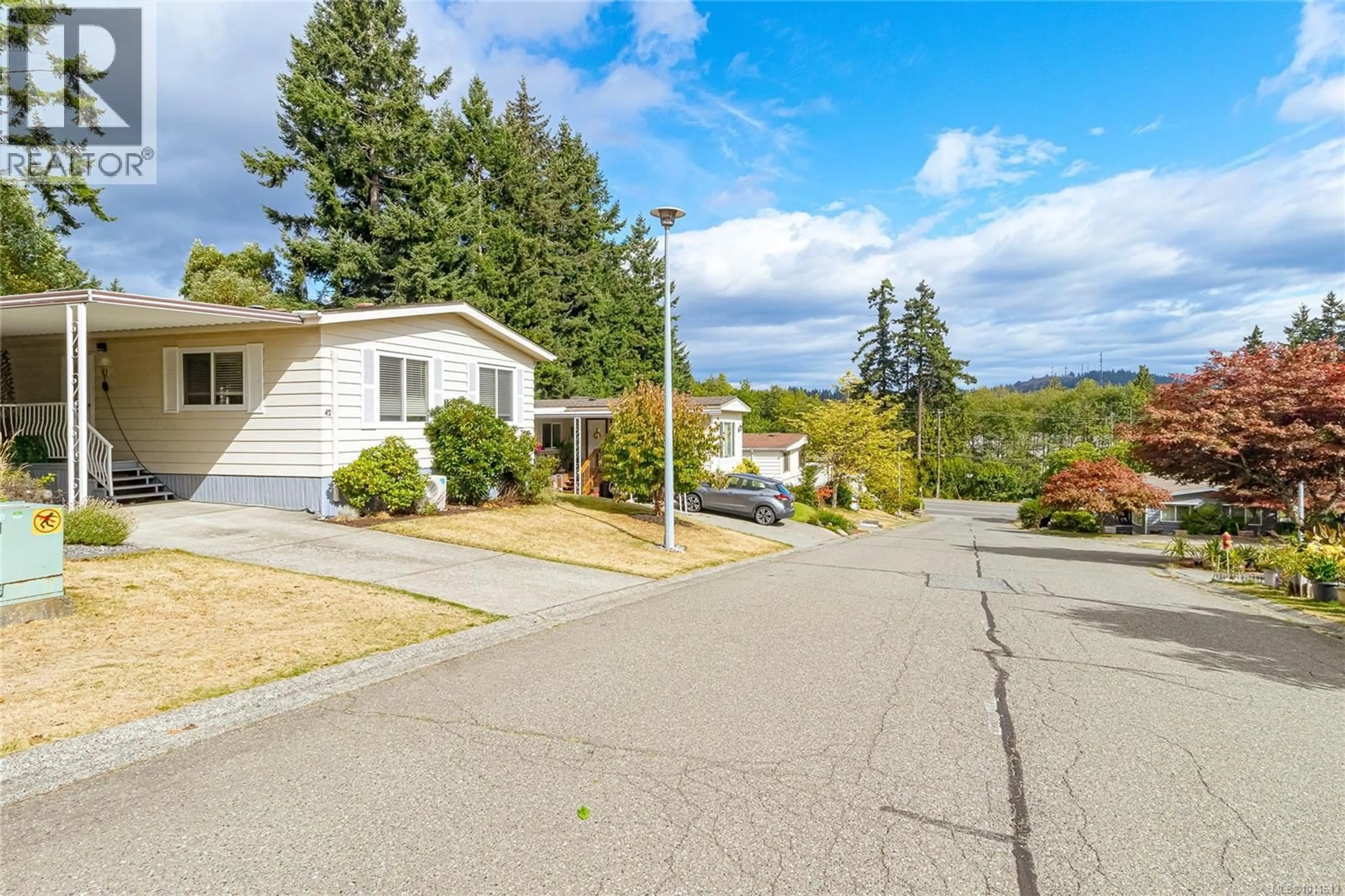 Home with vinyl exterior material, street for 42 - 2501 LABIEUX ROAD, Nanaimo British Columbia V9T5A6