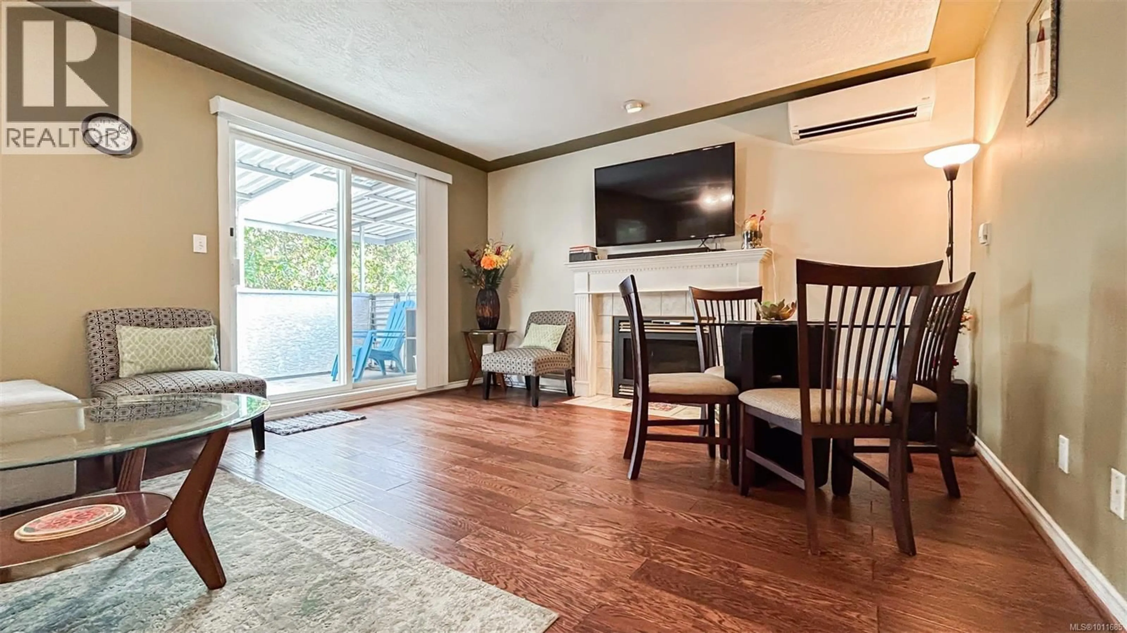 Living room with furniture, wood/laminate floor for 1988 MCTAVISH ROAD, North Saanich British Columbia V8L1C9