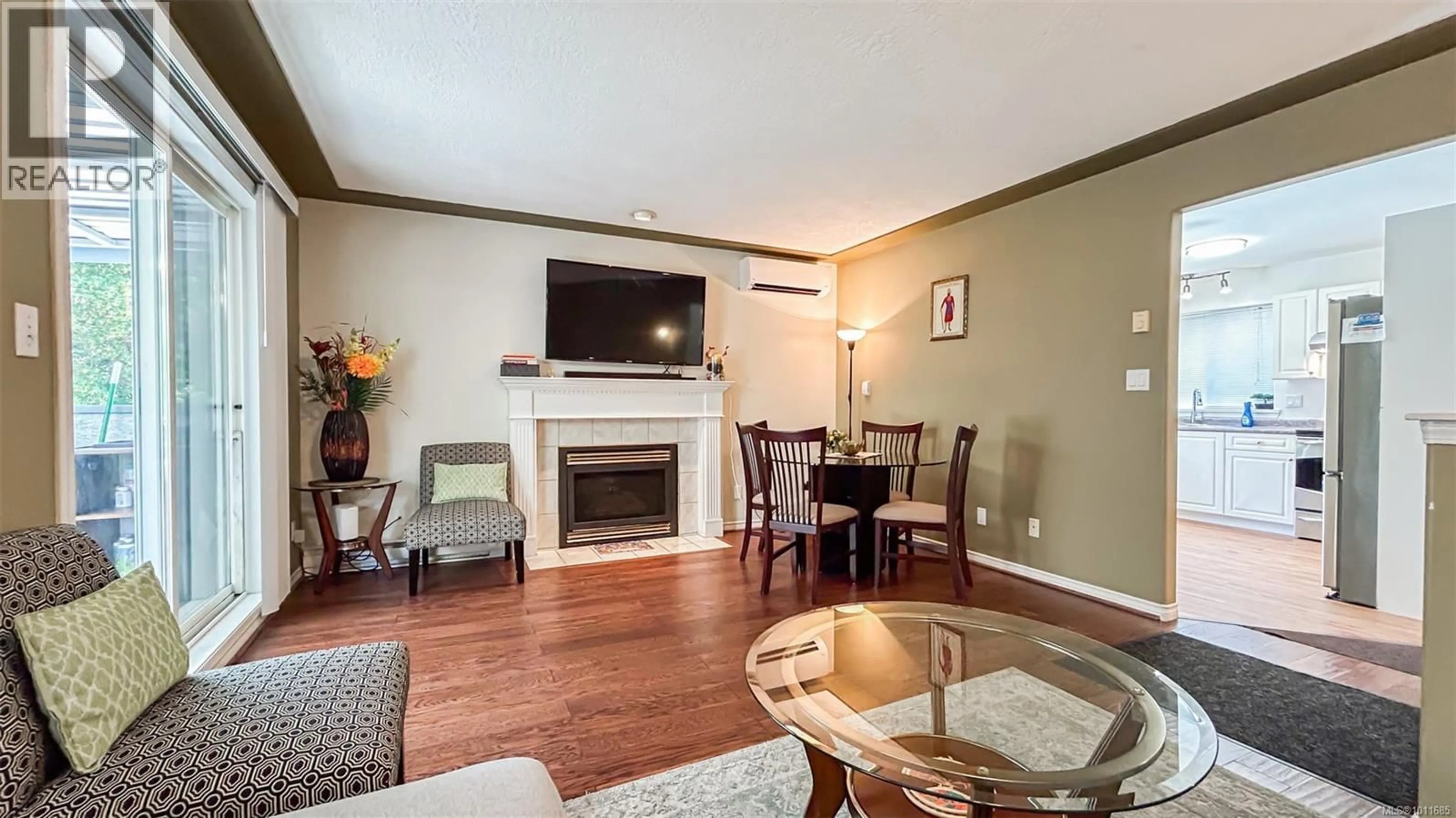 Living room with furniture, wood/laminate floor for 1988 MCTAVISH ROAD, North Saanich British Columbia V8L1C9