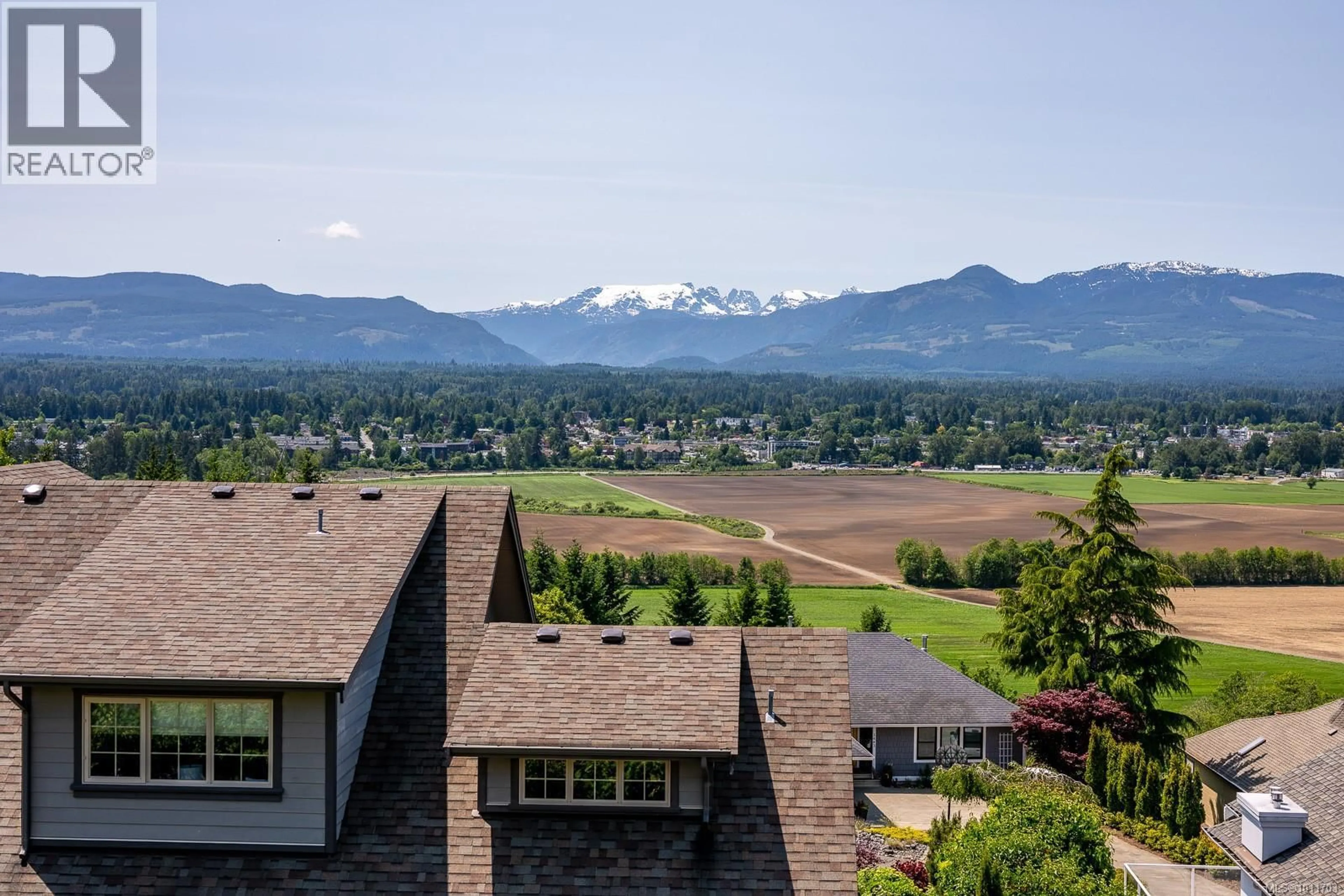 A pic from outside/outdoor area/front of a property/back of a property/a pic from drone, mountain view for 1597 TRUMPETER CRESCENT, Courtenay British Columbia V9N8W6