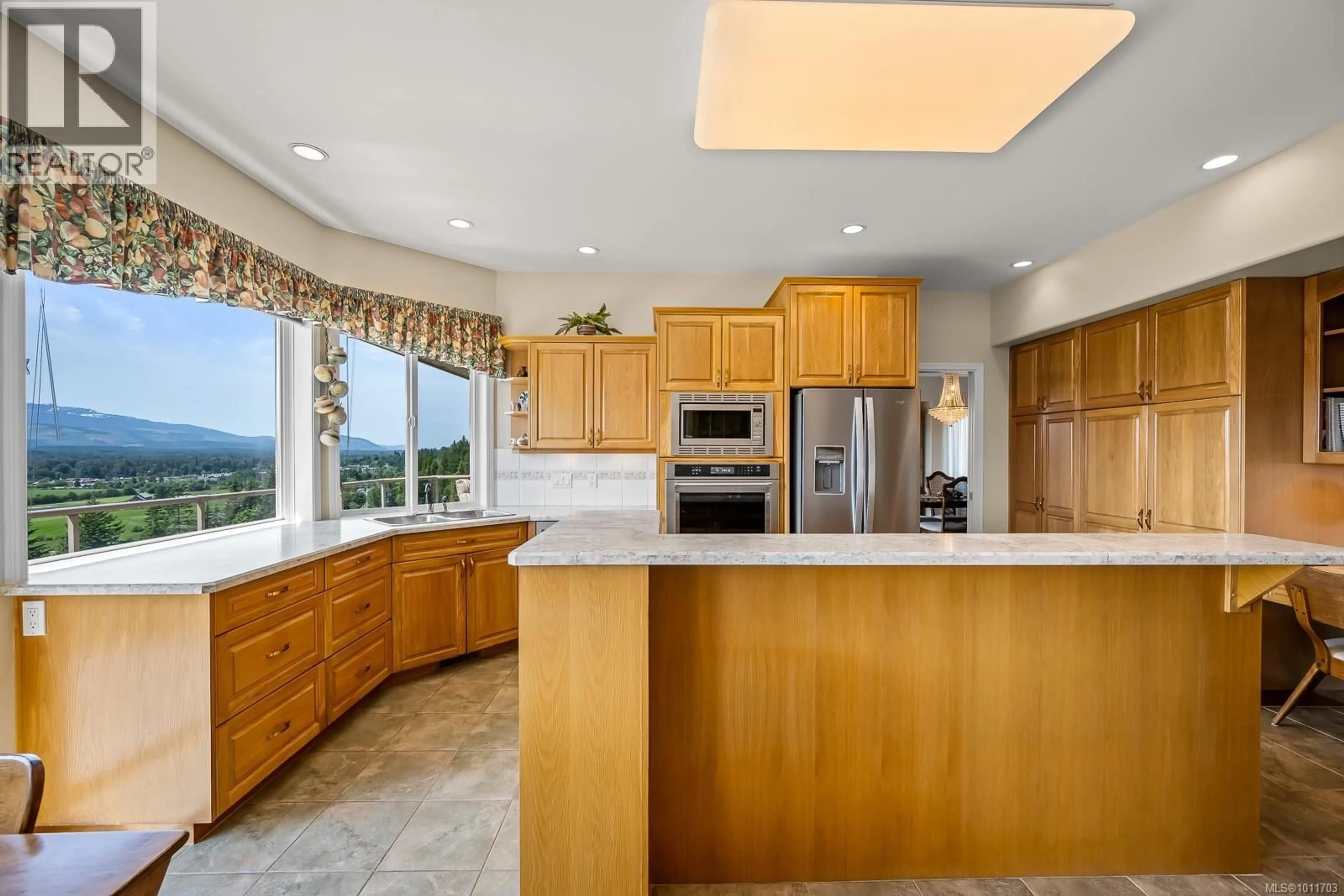 Open concept kitchen, ceramic/tile floor for 1597 TRUMPETER CRESCENT, Courtenay British Columbia V9N8W6