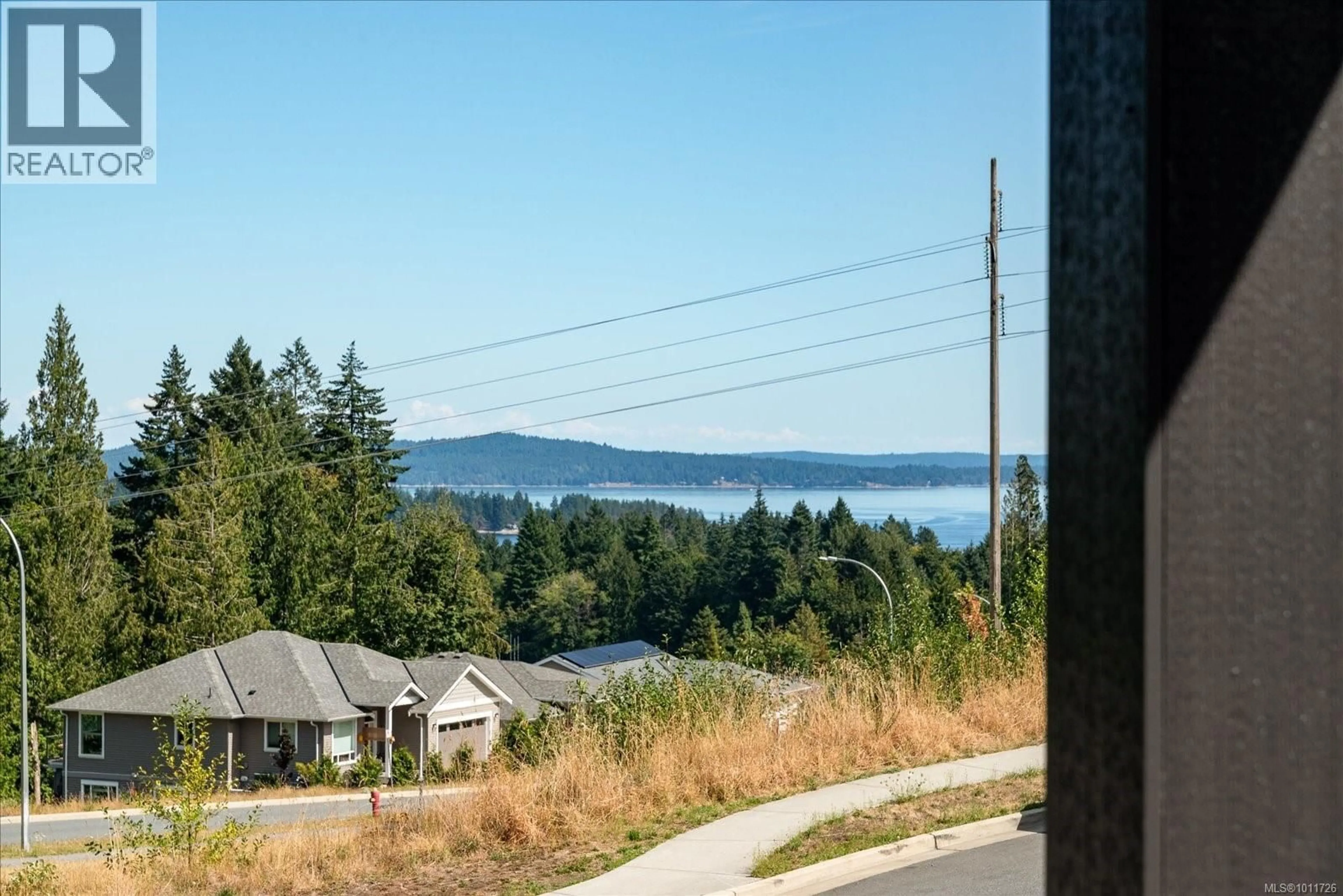 A pic from outside/outdoor area/front of a property/back of a property/a pic from drone, water/lake/river/ocean view for 405 COLONIA DRIVE SOUTH, Ladysmith British Columbia V9B0B8
