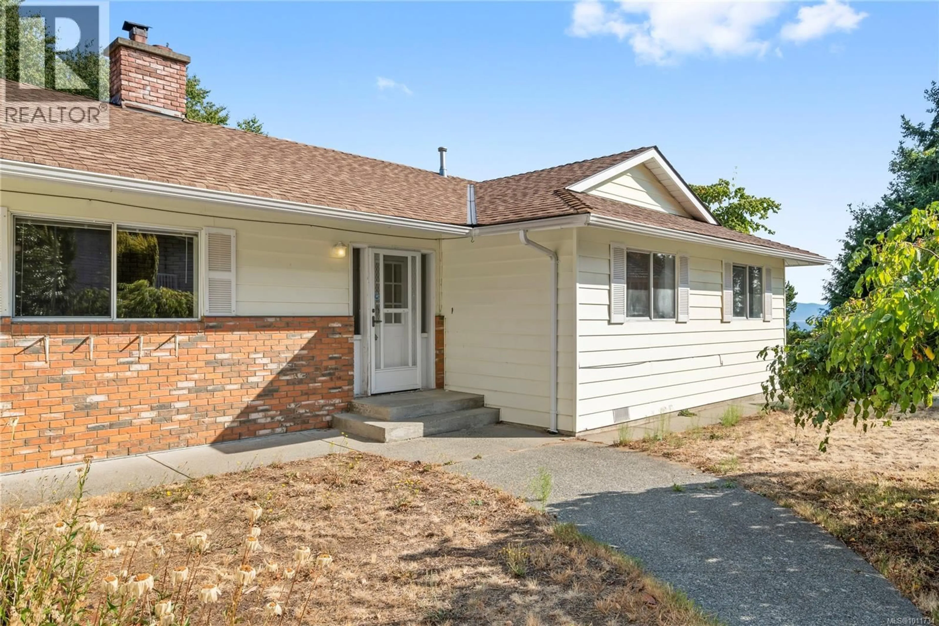 Home with vinyl exterior material, street for 6782 DICKINSON ROAD, Nanaimo British Columbia V9V1A2