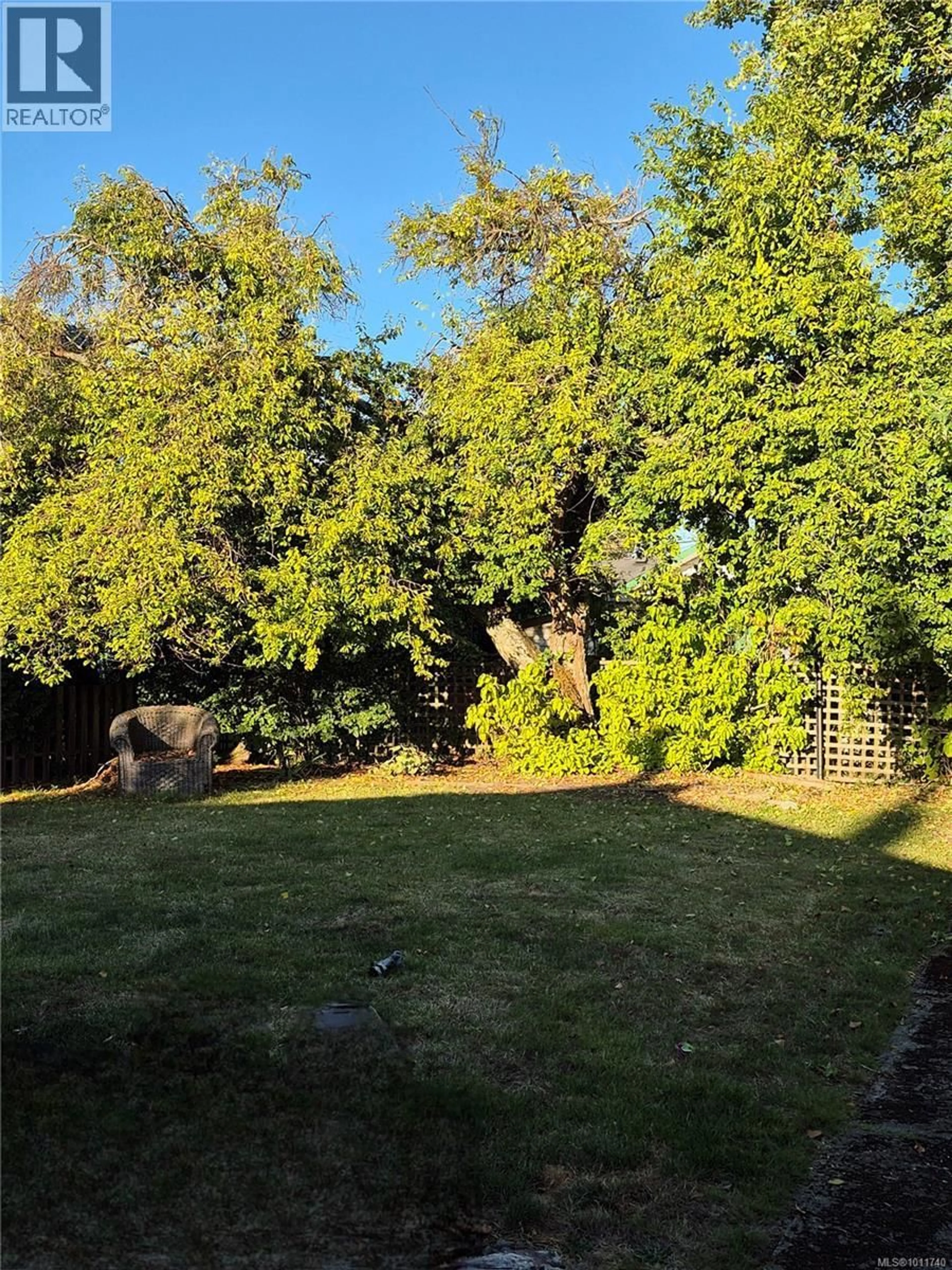 A pic from outside/outdoor area/front of a property/back of a property/a pic from drone, forest/trees view for 9691 FIFTH STREET, Sidney British Columbia V8L2W9