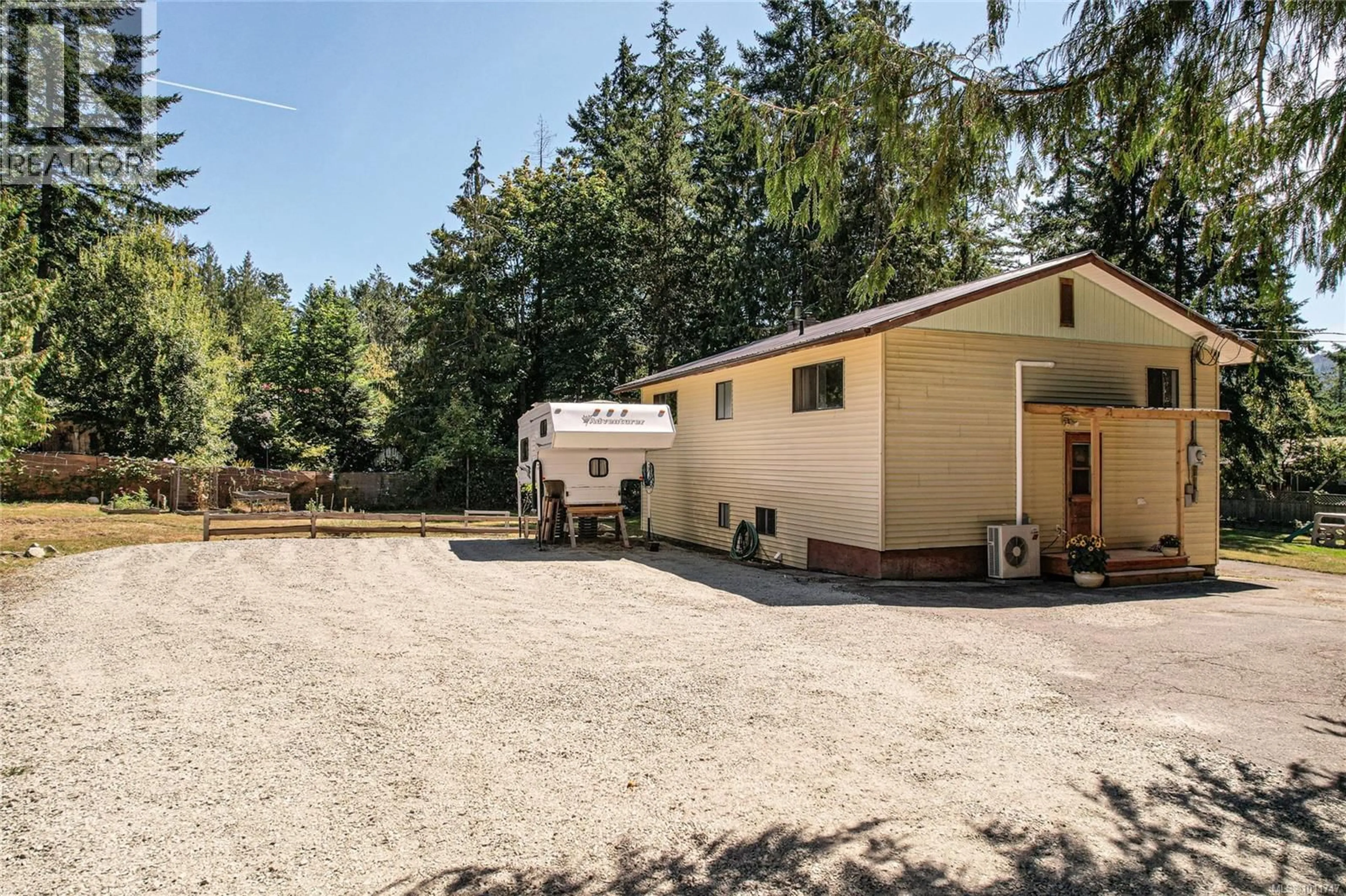 A pic from outside/outdoor area/front of a property/back of a property/a pic from drone, unknown for 210 WILDWOOD CRESCENT, Salt Spring British Columbia V8K2N7