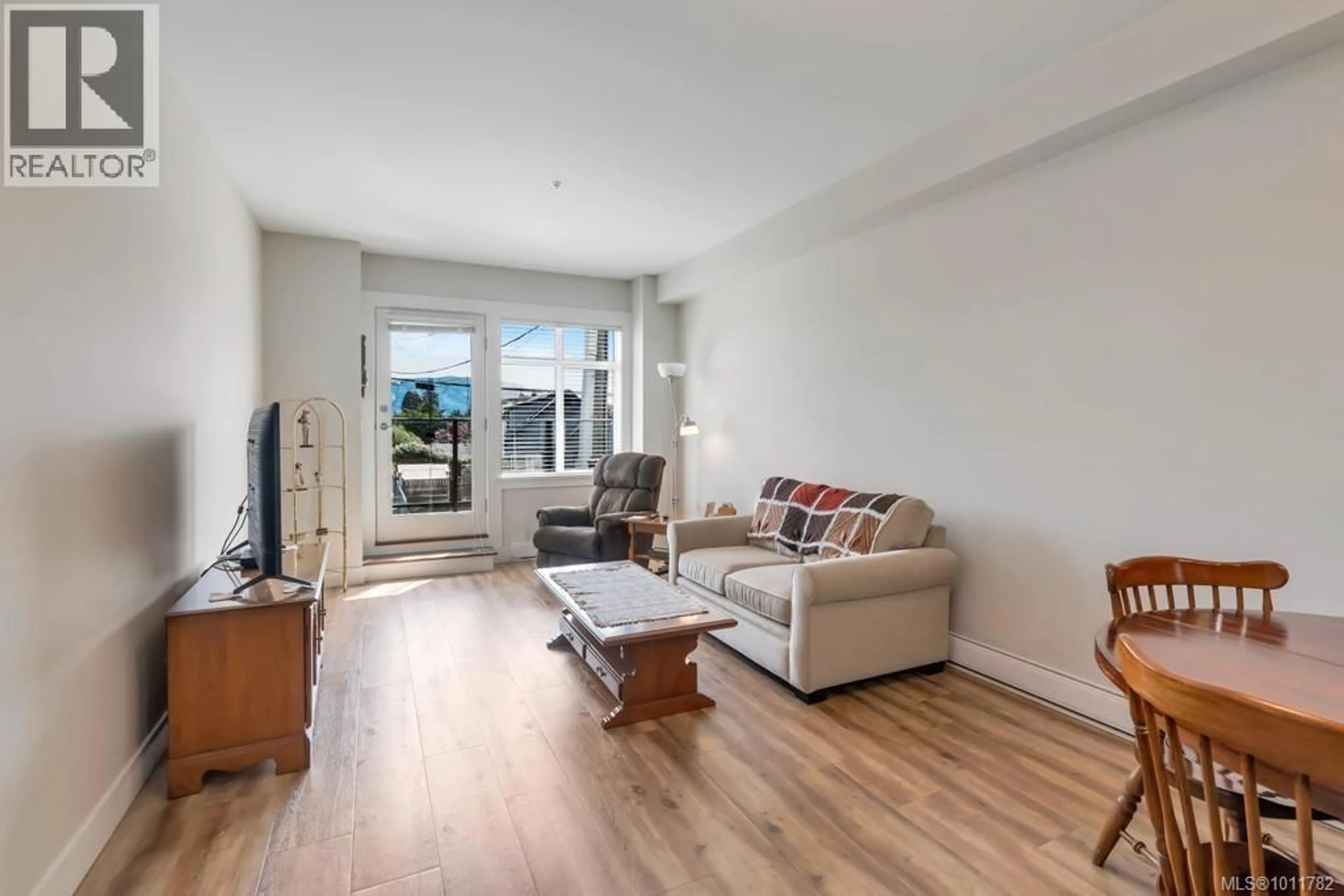 Living room with furniture, wood/laminate floor for 207 - 5822 GARDEN STREET, Duncan British Columbia V9L3V3