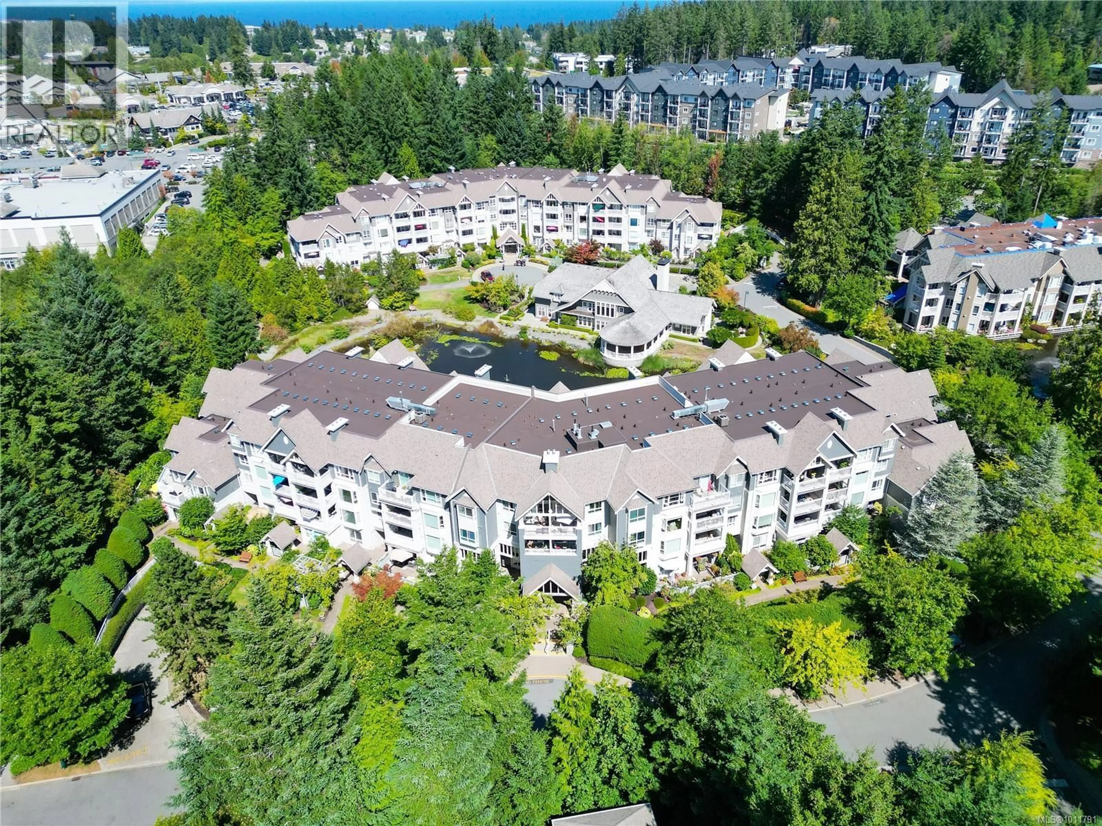 A pic from outside/outdoor area/front of a property/back of a property/a pic from drone, unknown for 402 - 5650 EDGEWATER LANE, Nanaimo British Columbia V9T6K1