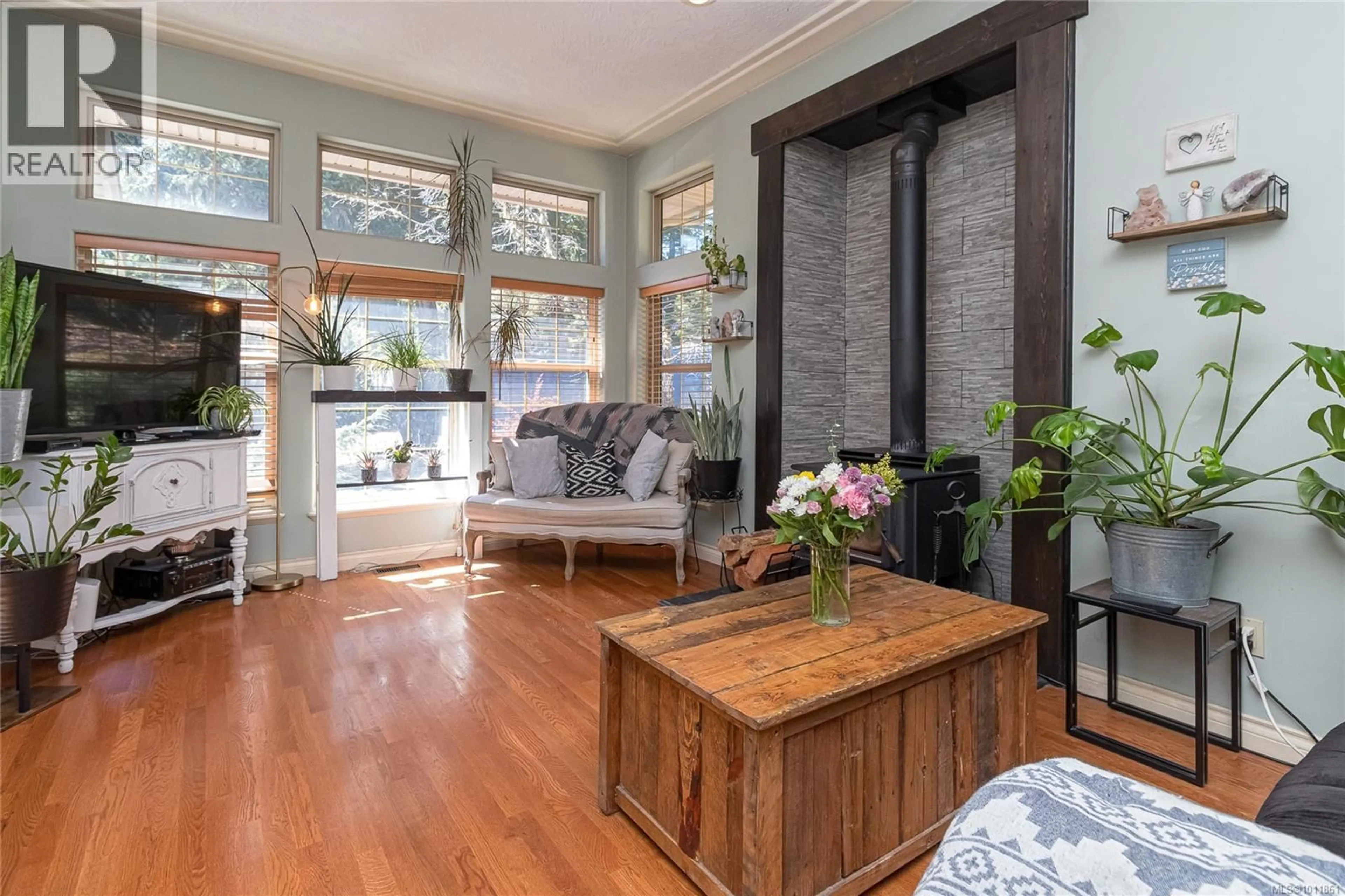 Living room with furniture, wood/laminate floor for 4875 AMBIENCE PLACE, Sooke British Columbia V9Z1C5