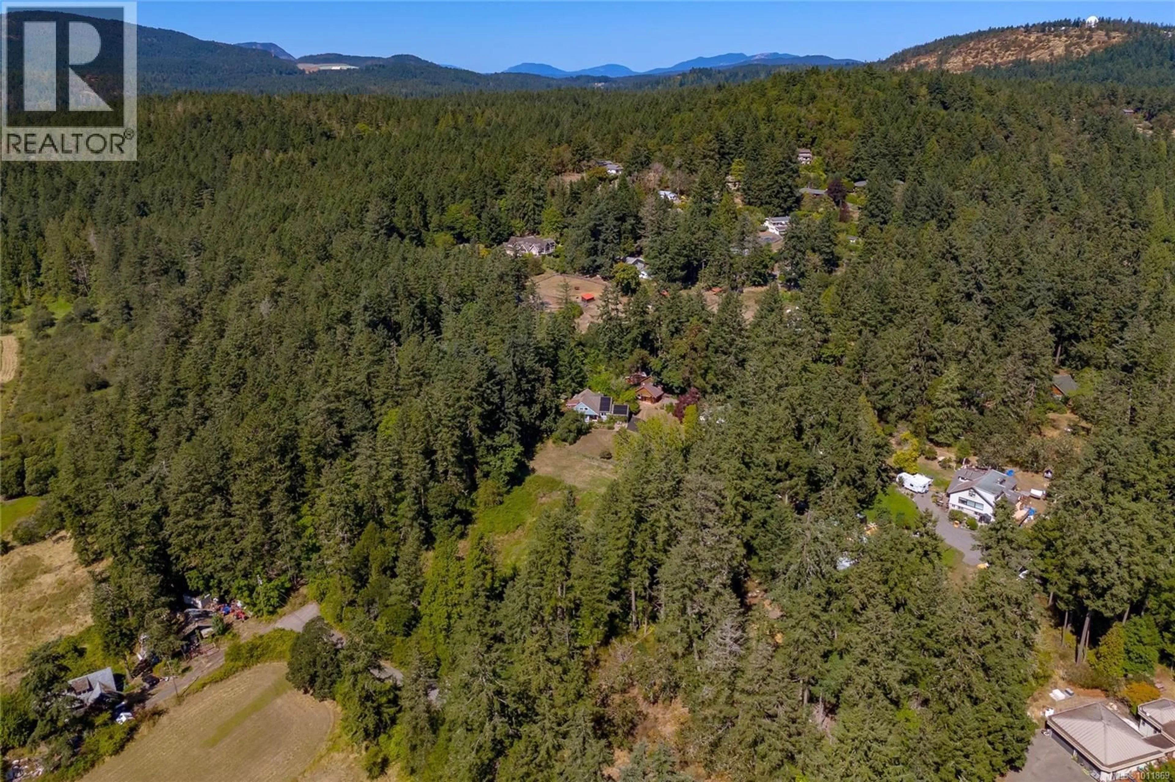 A pic from outside/outdoor area/front of a property/back of a property/a pic from drone, forest/trees view for 4664-4670 SPRING ROAD, Saanich British Columbia V9E2B5