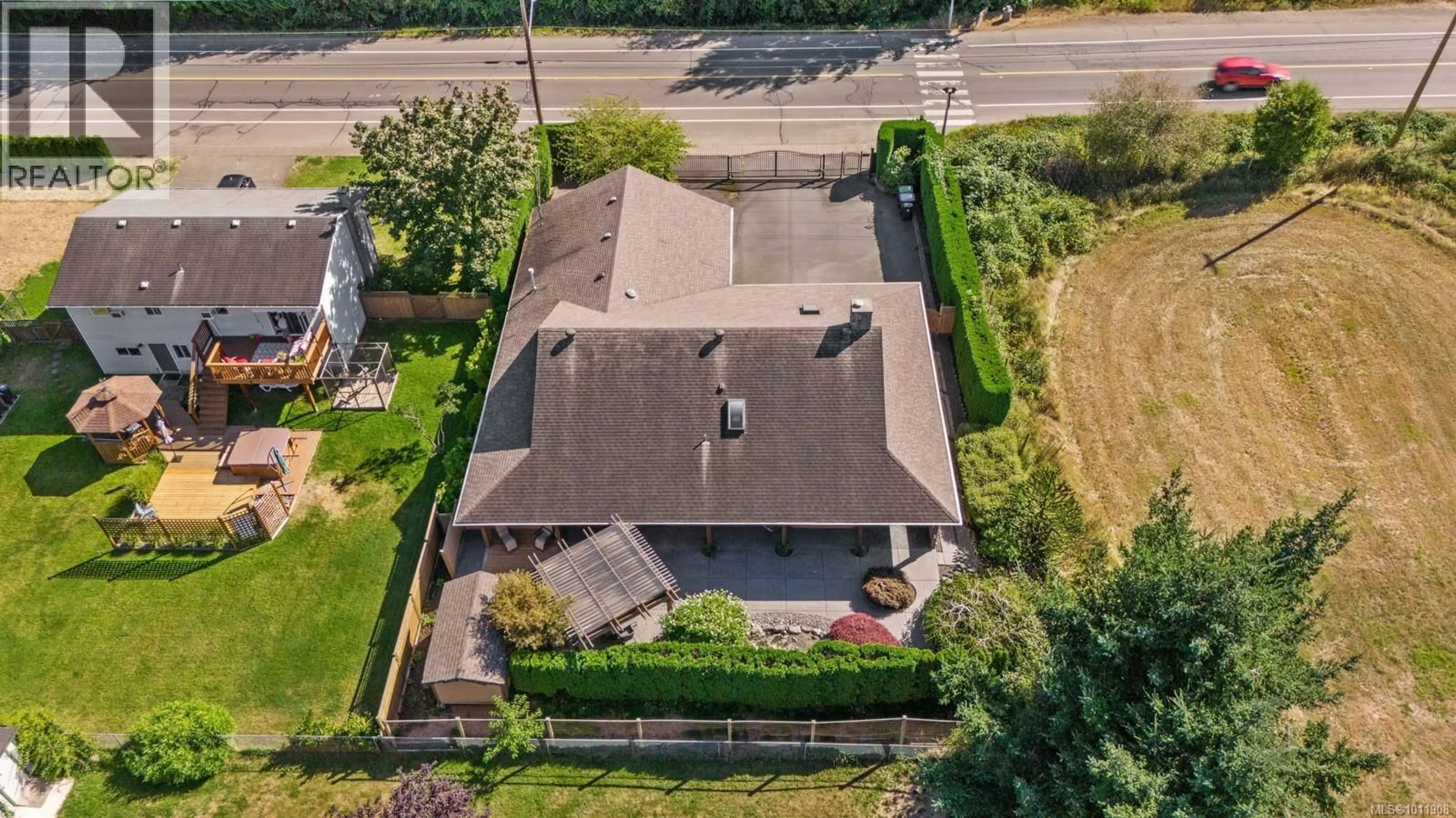 A pic from outside/outdoor area/front of a property/back of a property/a pic from drone, street for 1680 GUTHRIE ROAD, Comox British Columbia V9M1A7