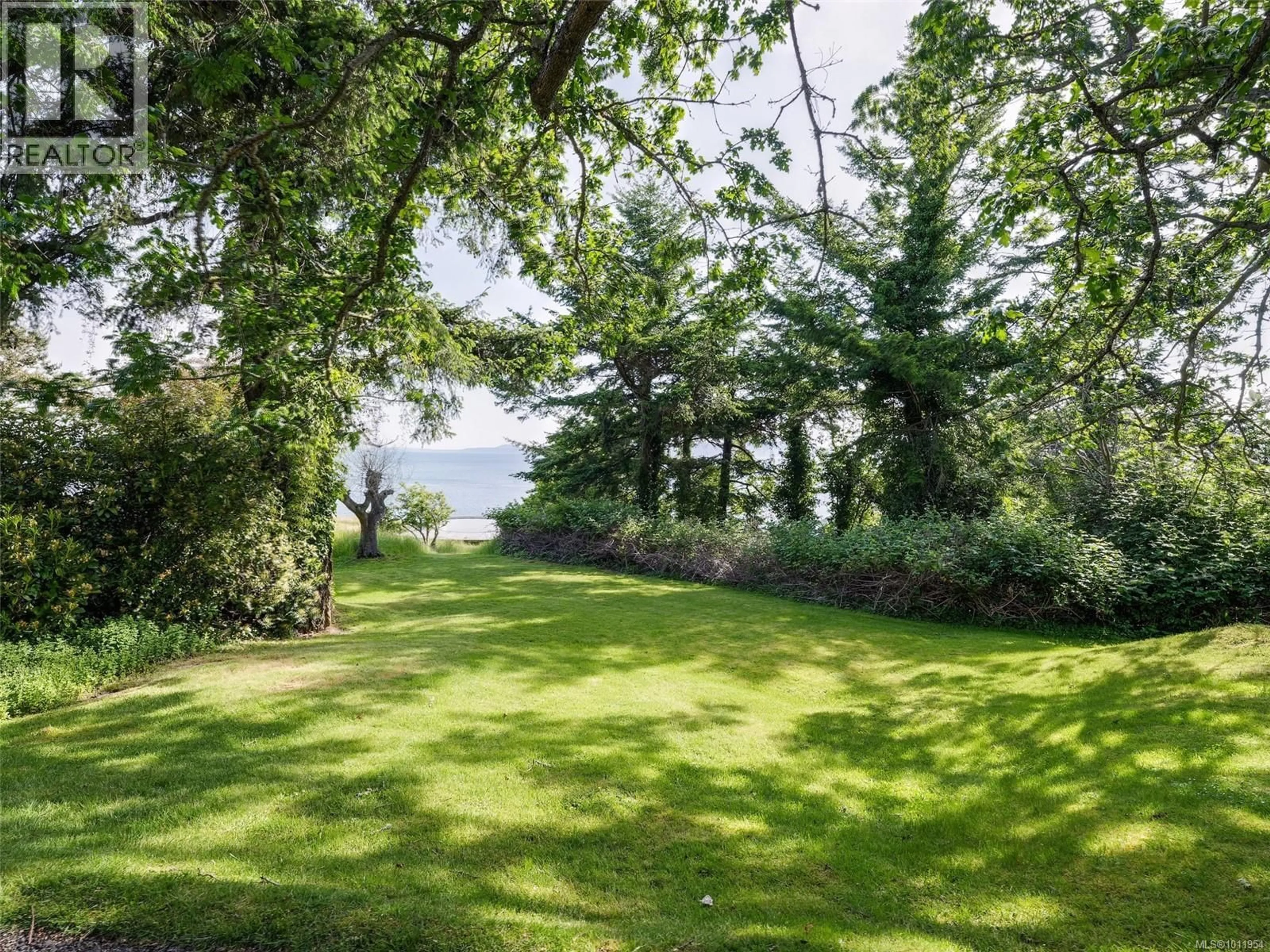 A pic from outside/outdoor area/front of a property/back of a property/a pic from drone, forest/trees view for 2550 QUEENSWOOD DRIVE, Saanich British Columbia V8N1X5