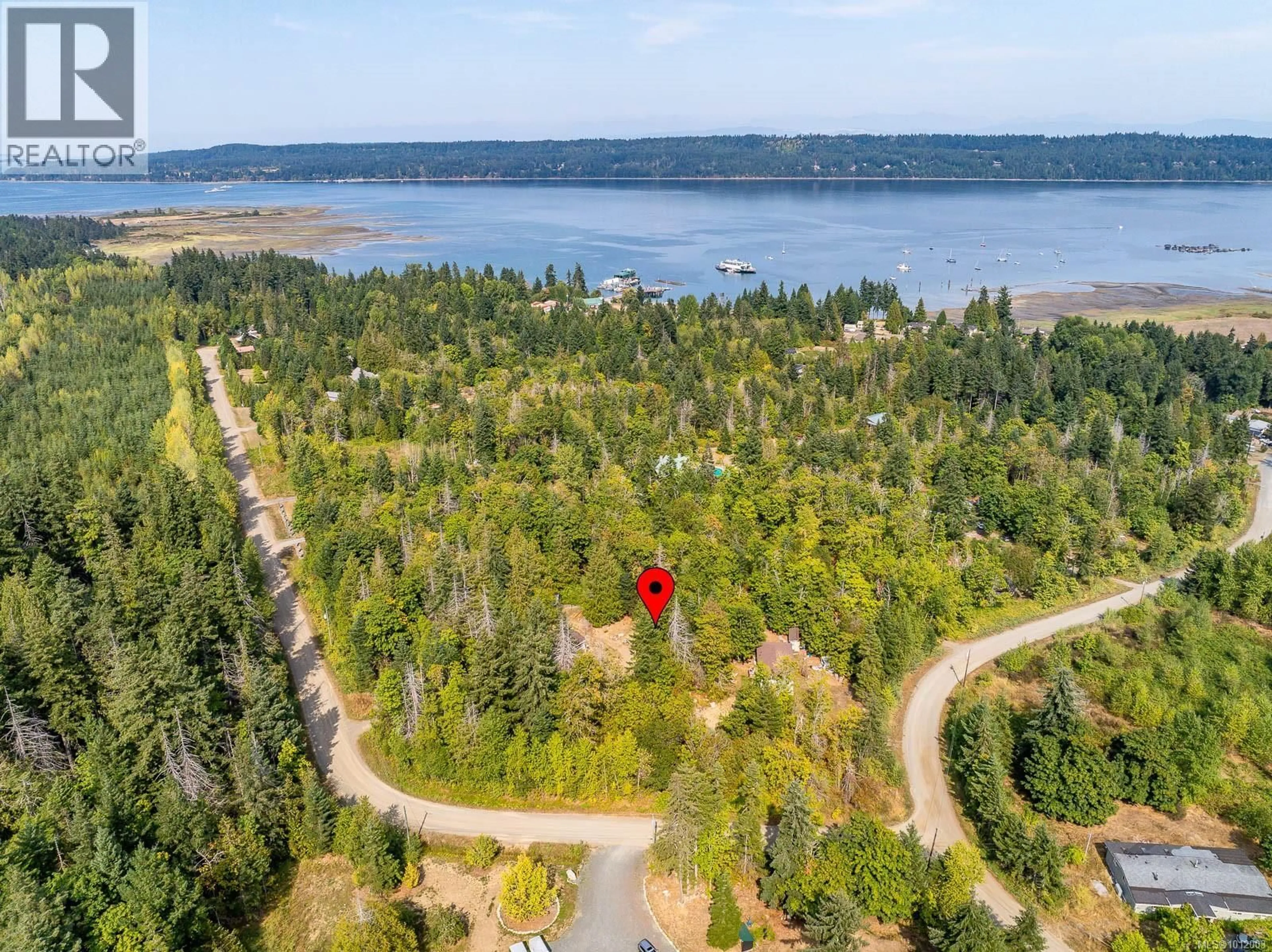 A pic from outside/outdoor area/front of a property/back of a property/a pic from drone, water/lake/river/ocean view for 7390 COUGAR SMITH ROAD, Fanny Bay British Columbia V0R1W0