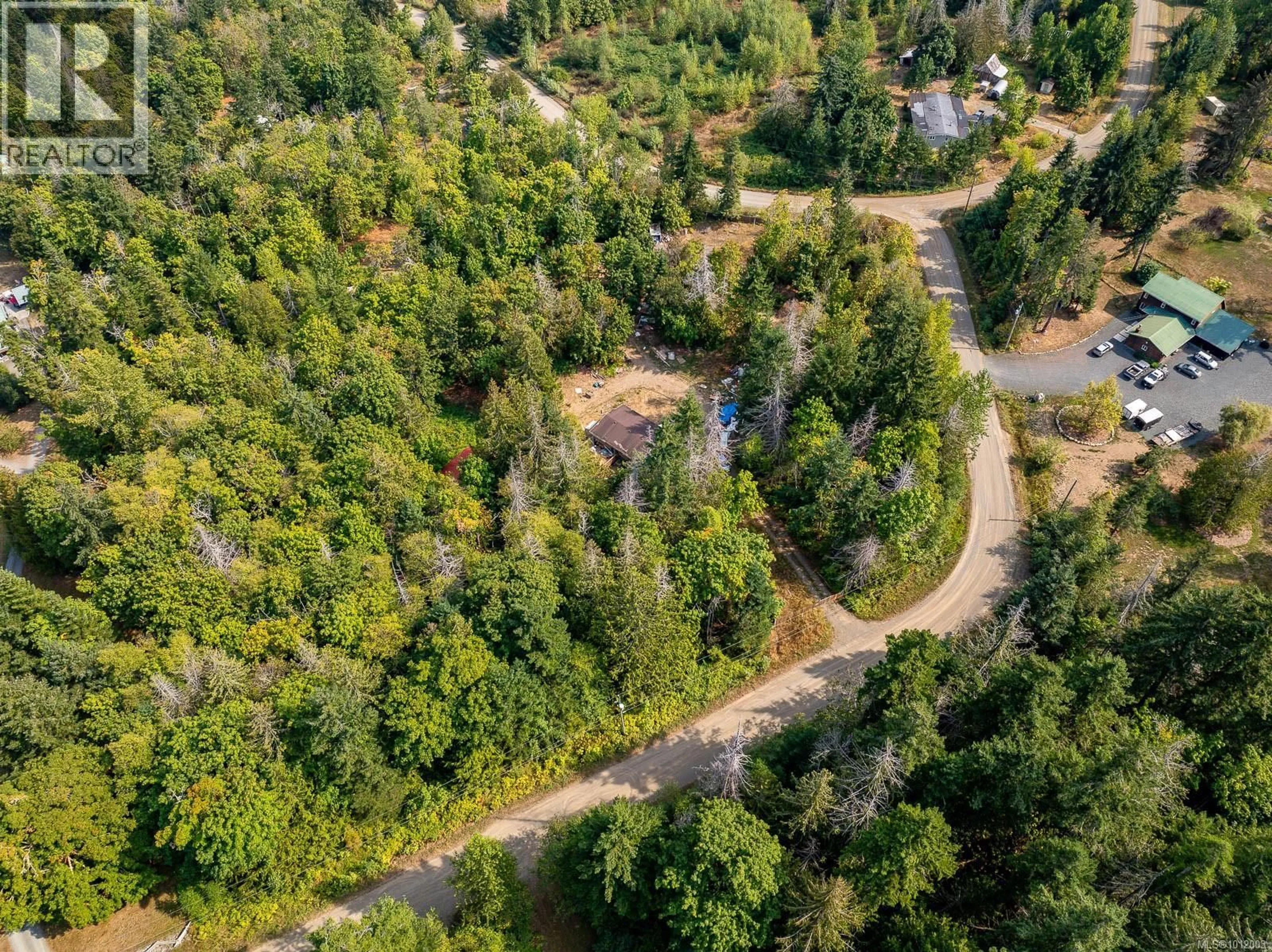 A pic from outside/outdoor area/front of a property/back of a property/a pic from drone, forest/trees view for 7390 COUGAR SMITH ROAD, Fanny Bay British Columbia V0R1W0