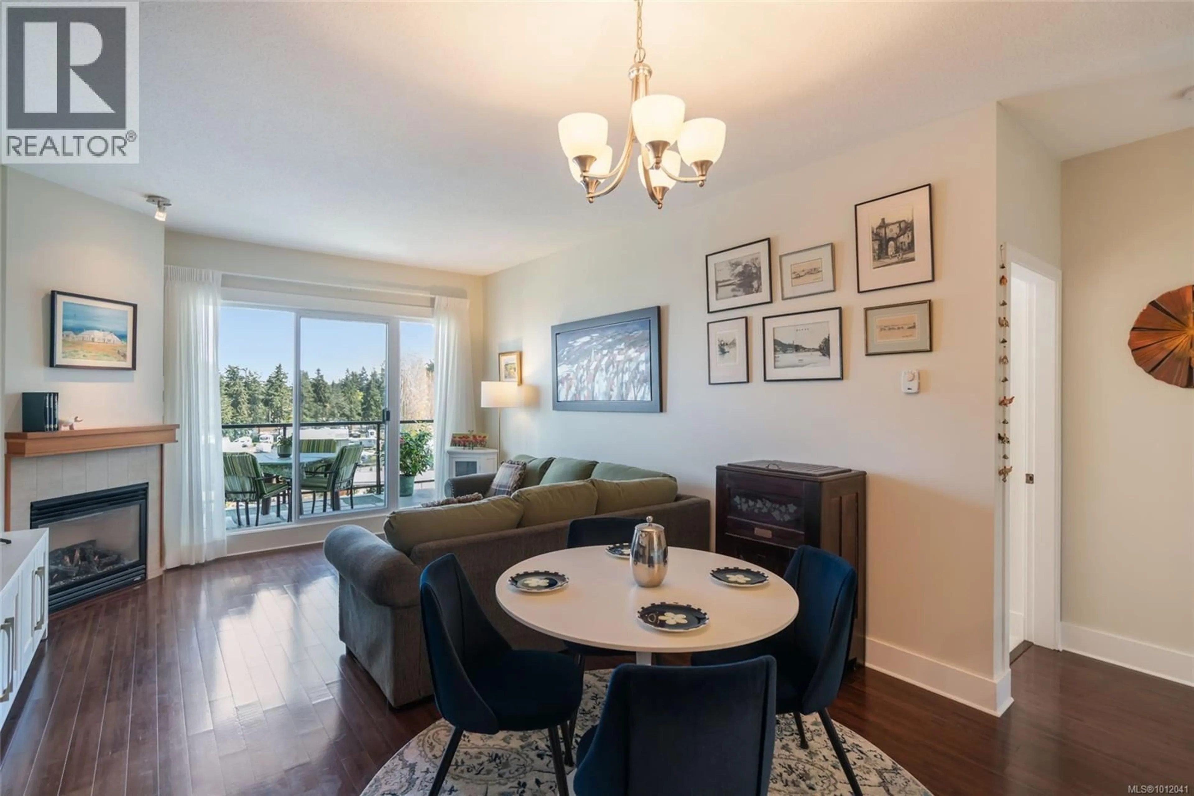 Living room with furniture, wood/laminate floor for 604 - 194 BEACHSIDE DRIVE, Parksville British Columbia V9P0B1