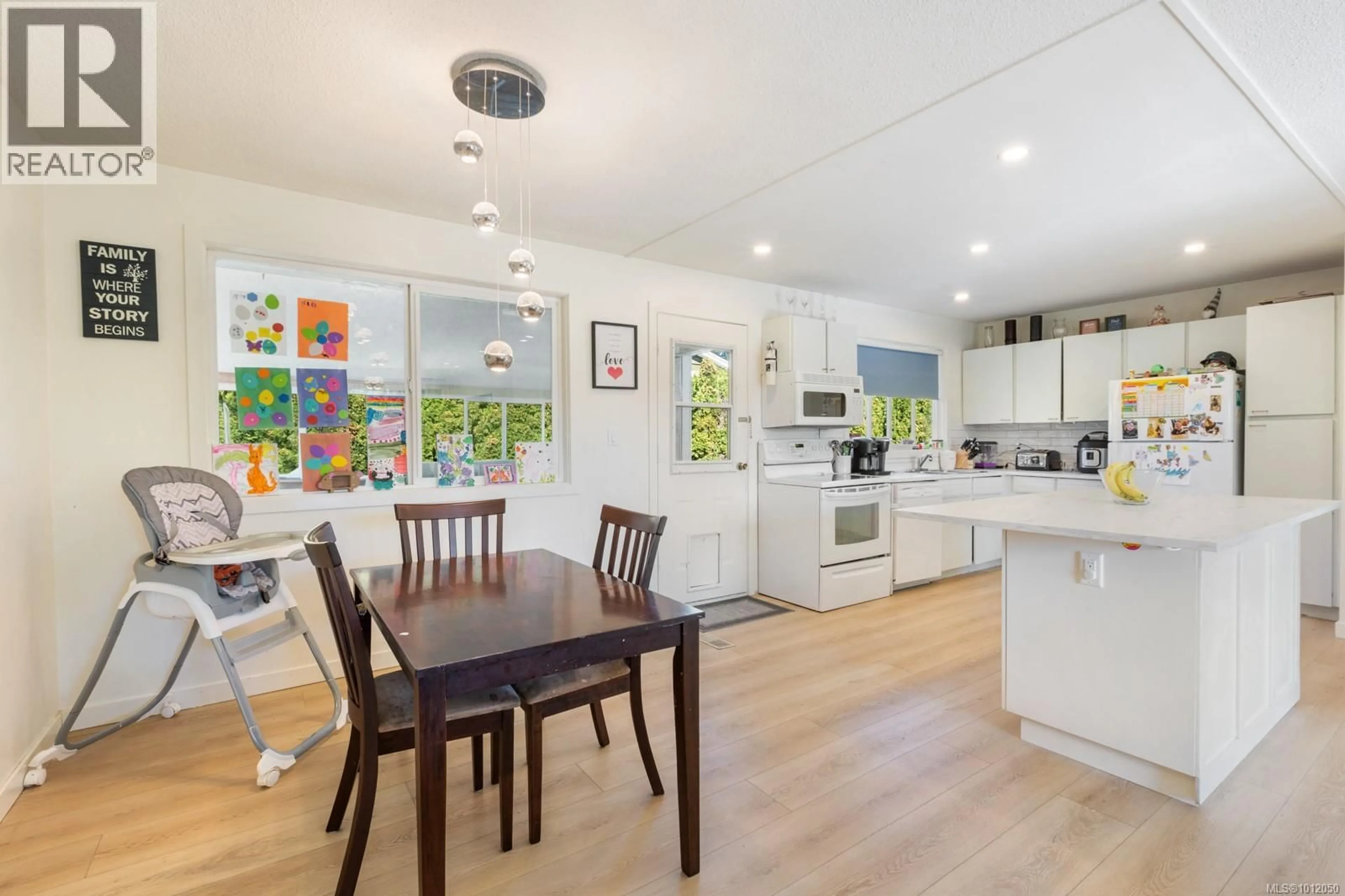 Open concept kitchen, wood/laminate floor for 525 SALISH STREET, Comox British Columbia V9M5L5