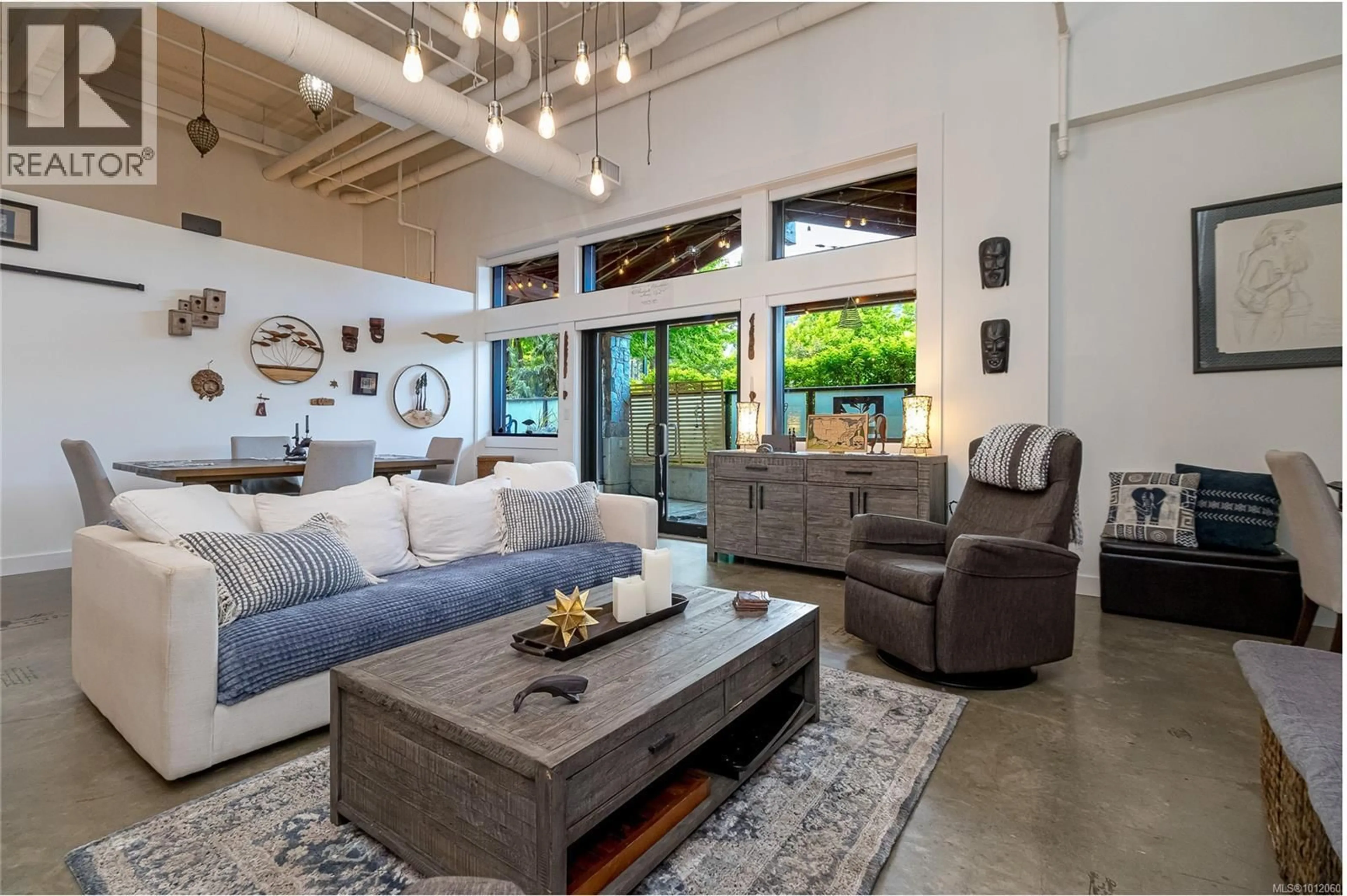 Living room with furniture, cement floor for 106 - 2049 COUNTRY CLUB WAY, Langford British Columbia V9B0H8