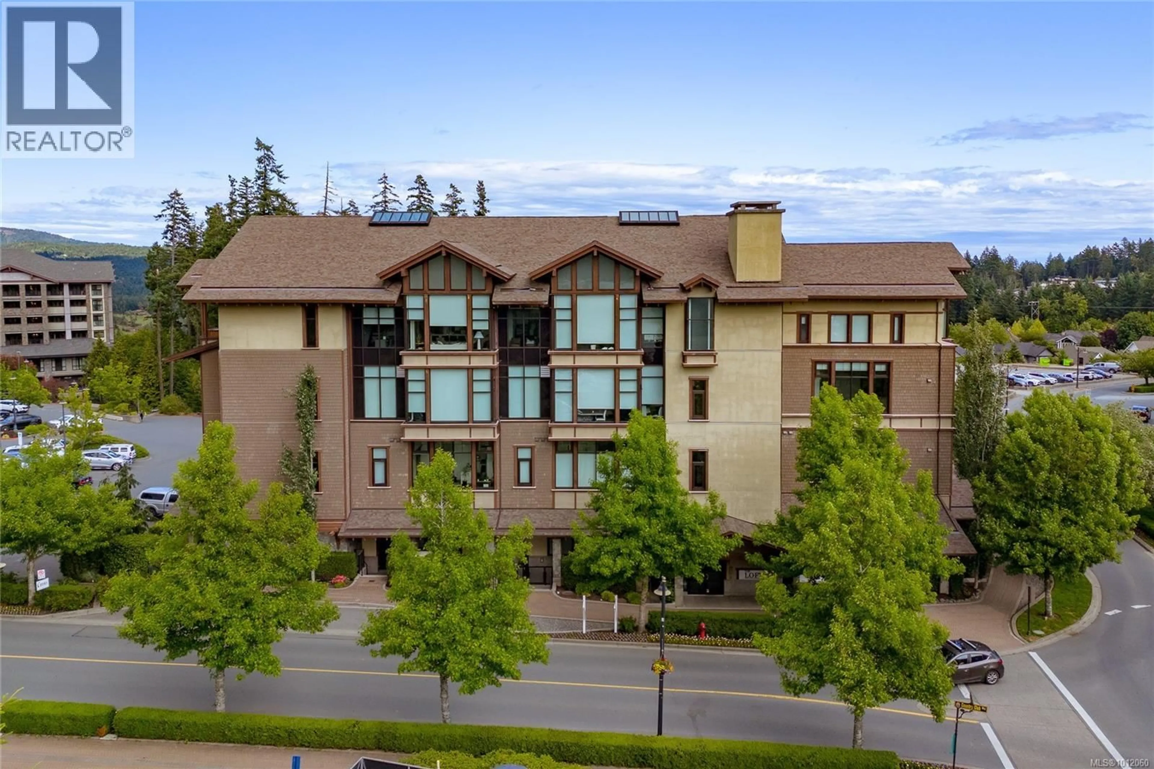 A pic from outside/outdoor area/front of a property/back of a property/a pic from drone, unknown for 106 - 2049 COUNTRY CLUB WAY, Langford British Columbia V9B0H8