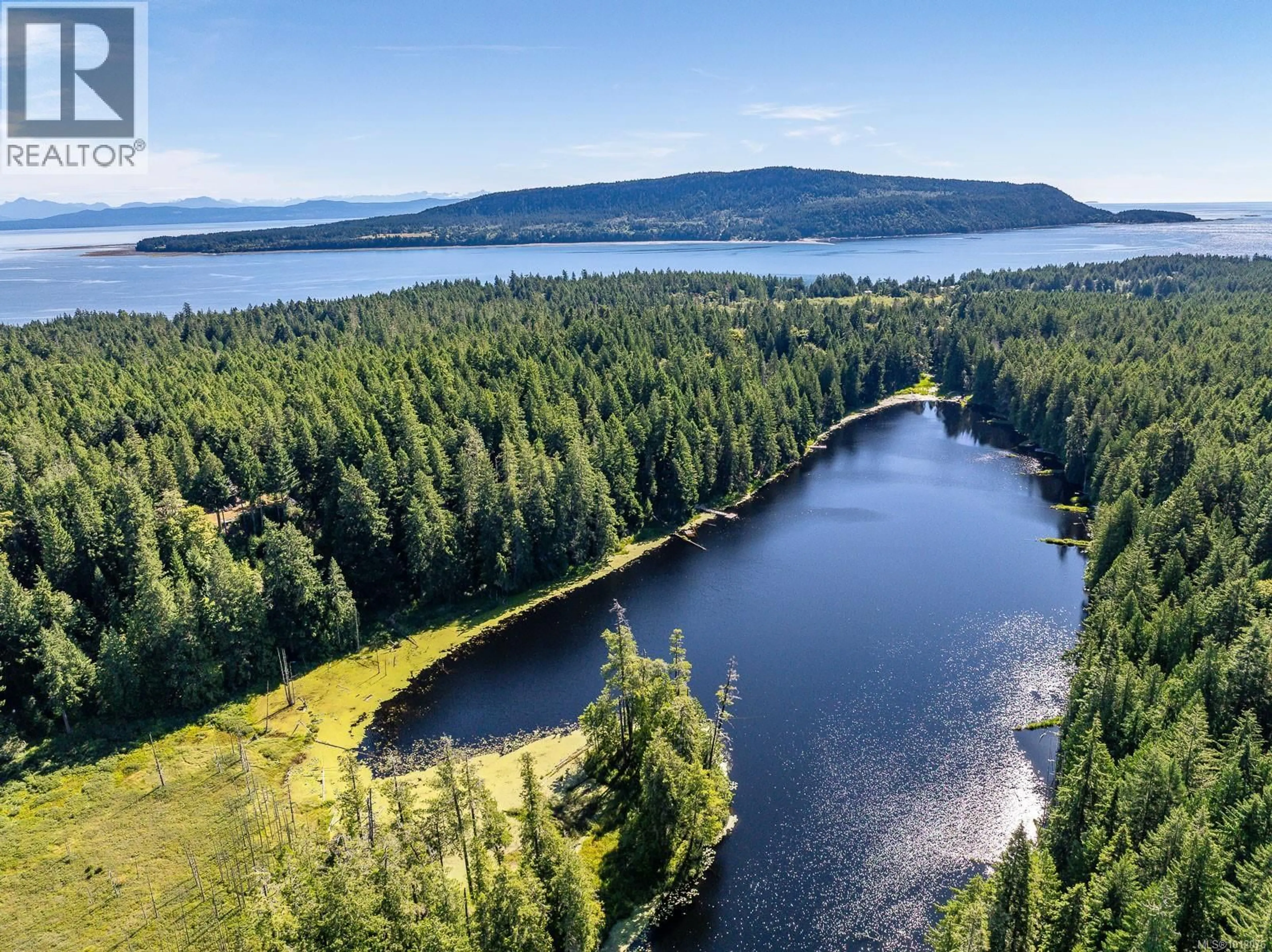 A pic from outside/outdoor area/front of a property/back of a property/a pic from drone, water/lake/river/ocean view for 8905 MALLARD WAY, Denman Island British Columbia V0R1T0