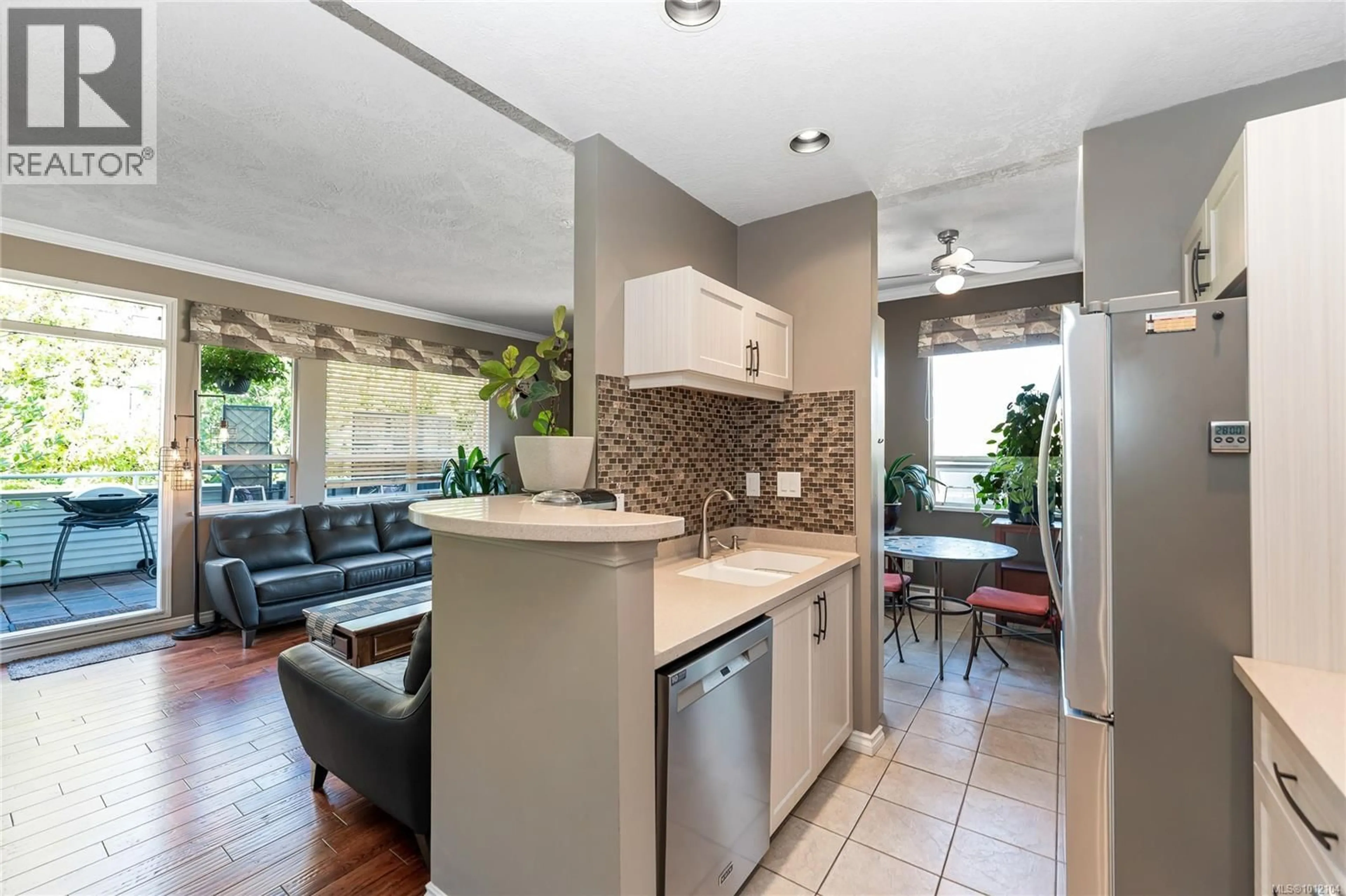Open concept kitchen, ceramic/tile floor for 404 - 380 WATERFRONT CRESCENT, Victoria British Columbia V8T5K3