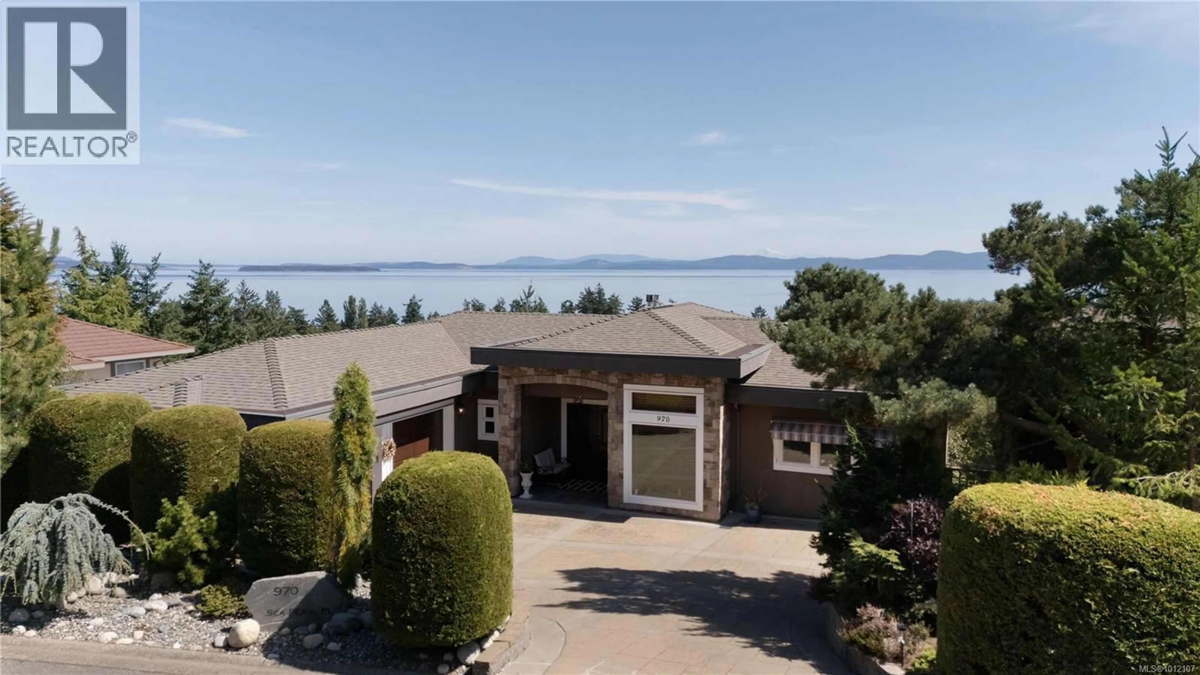 A pic from outside/outdoor area/front of a property/back of a property/a pic from drone, water/lake/river/ocean view for 970 SEAPEARL PLACE, Saanich British Columbia V8Y2X2