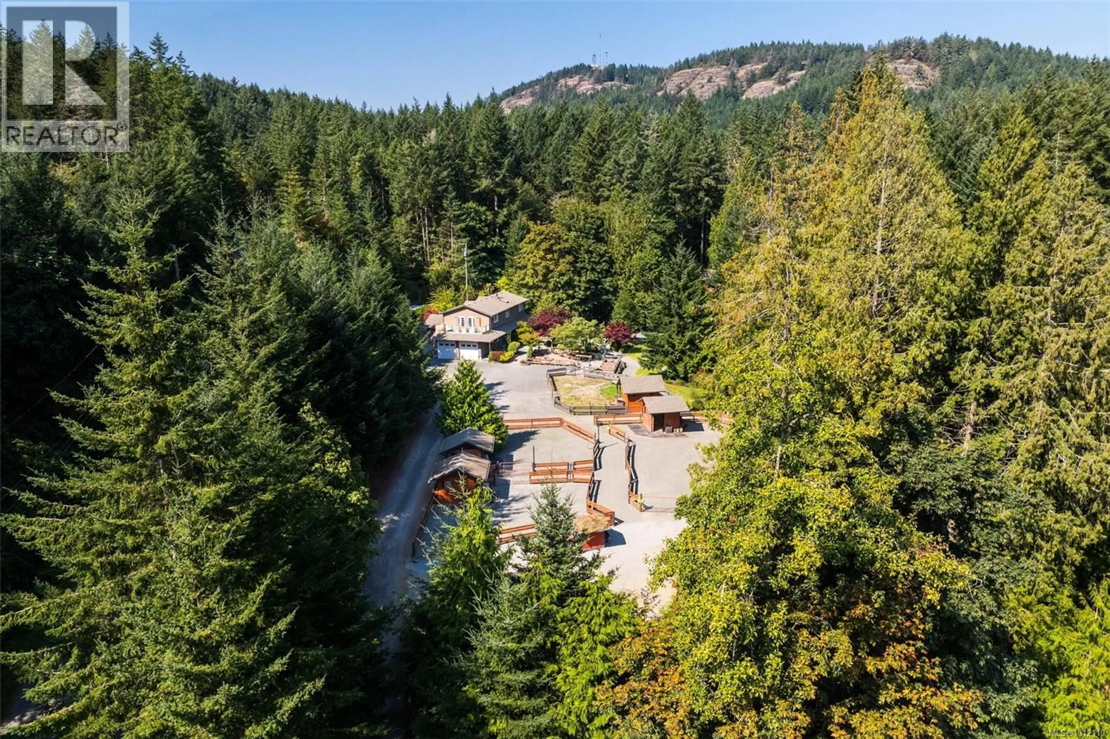 A pic from outside/outdoor area/front of a property/back of a property/a pic from drone, forest/trees view for 4466 LINDHOLM ROAD, Metchosin British Columbia V9C3Y1
