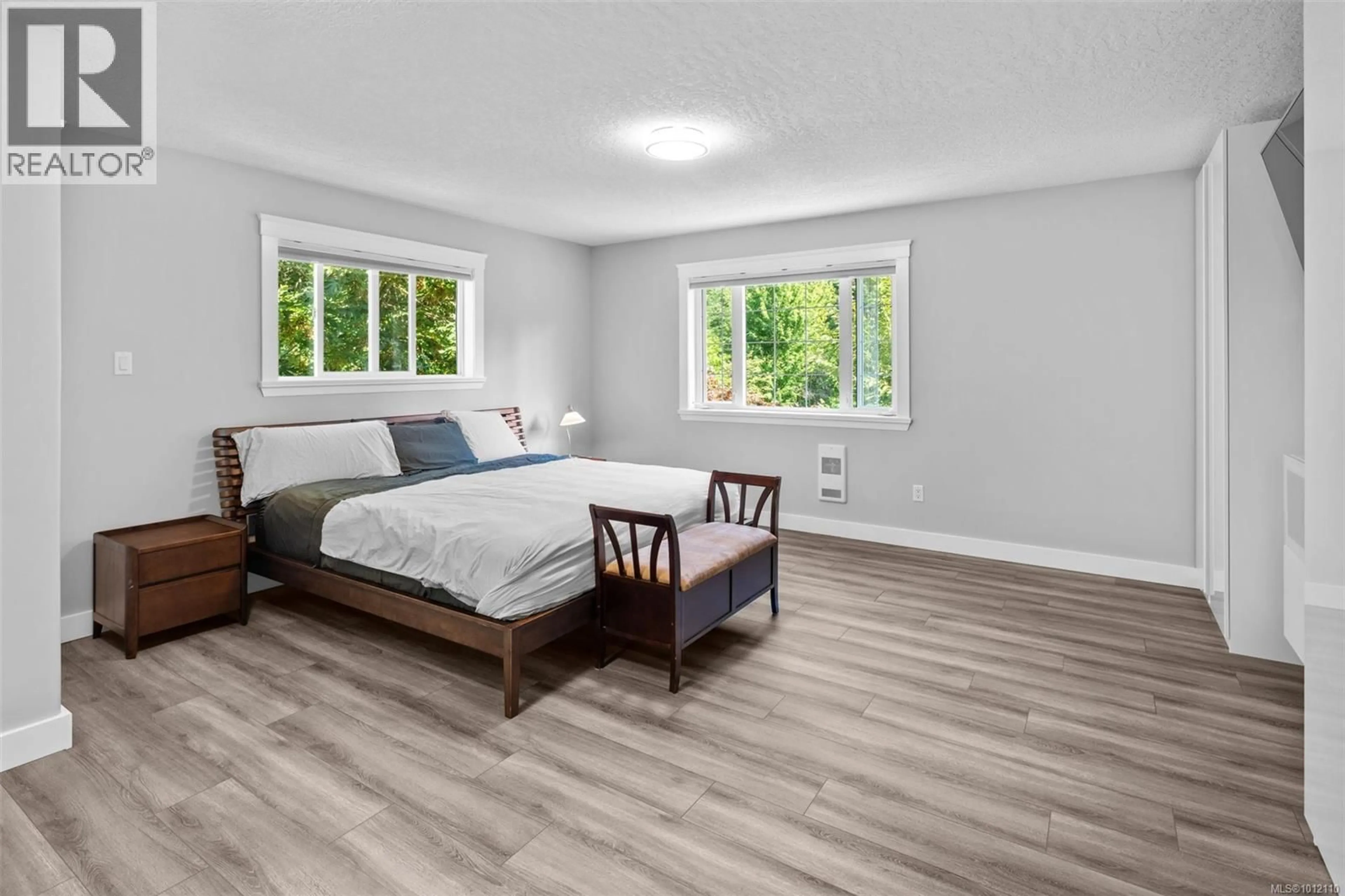 Bedroom with bed, wood/laminate floor for 4466 LINDHOLM ROAD, Metchosin British Columbia V9C3Y1