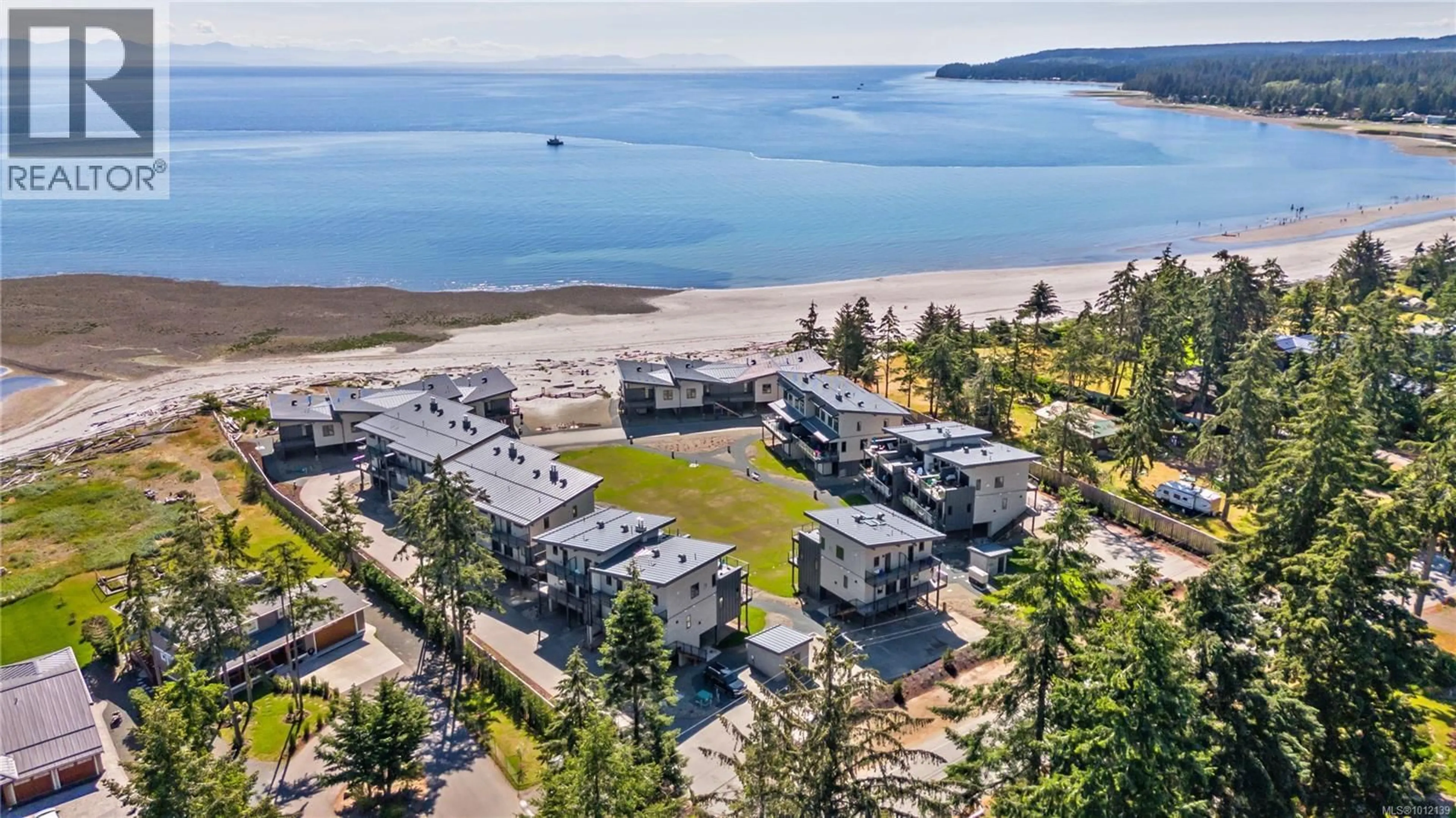 A pic from outside/outdoor area/front of a property/back of a property/a pic from drone, water/lake/river/ocean view for 19 - 9022 CLARKSON AVENUE, Black Creek British Columbia V9J1B3