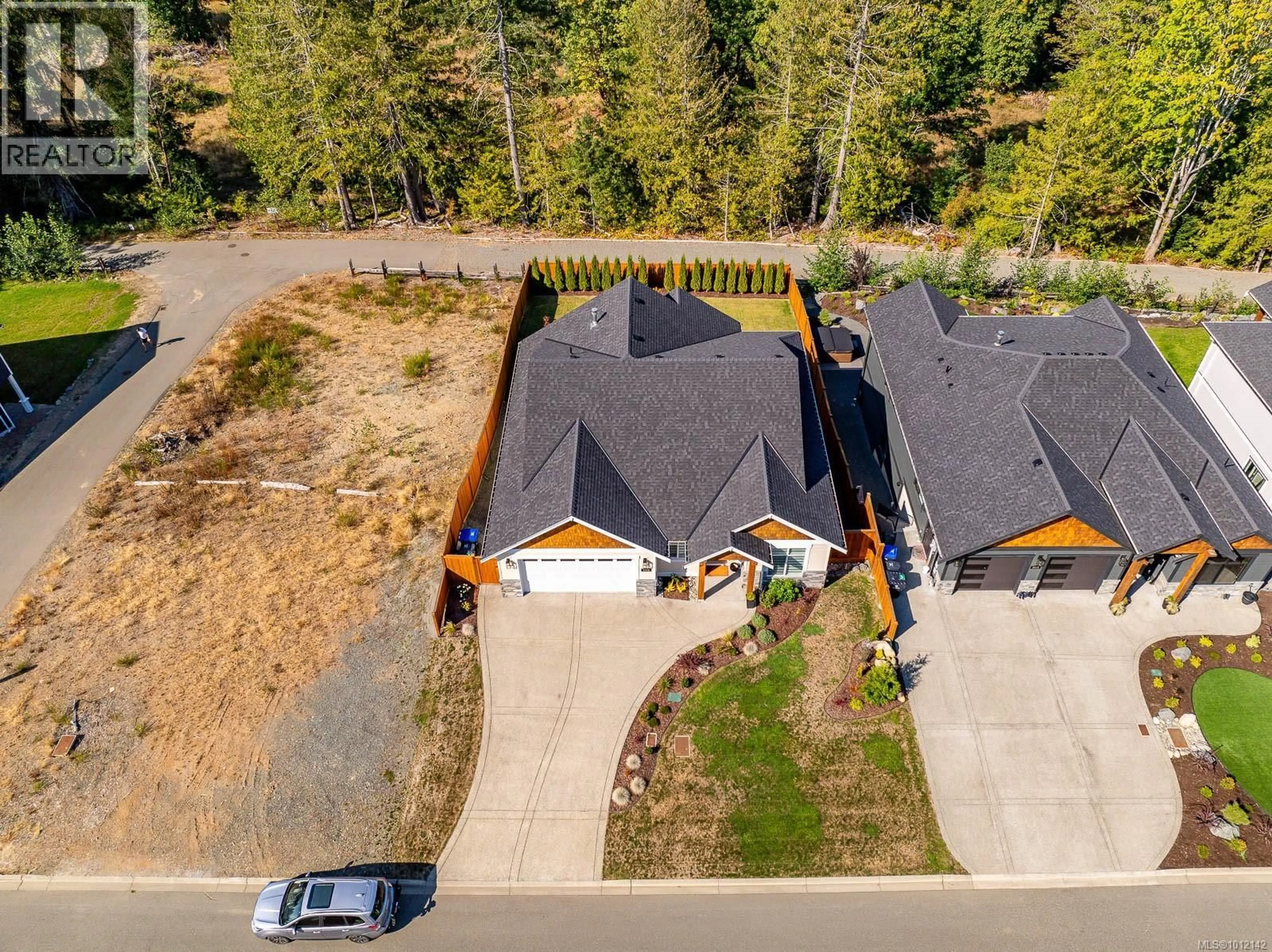 A pic from outside/outdoor area/front of a property/back of a property/a pic from drone, street for 3248 KLANAWA CRESCENT, Courtenay British Columbia V9N0H4