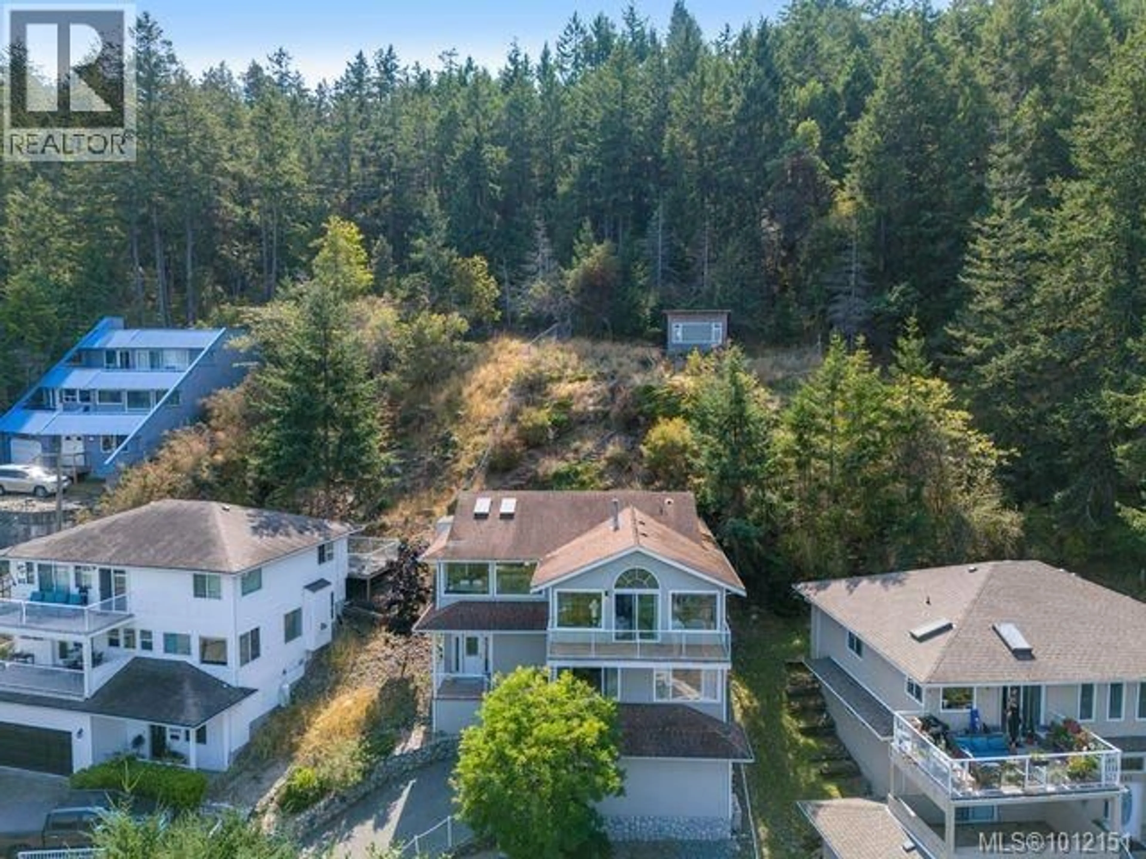 A pic from outside/outdoor area/front of a property/back of a property/a pic from drone, forest/trees view for 4895 LAGUNA WAY, Nanaimo British Columbia V9T5C2