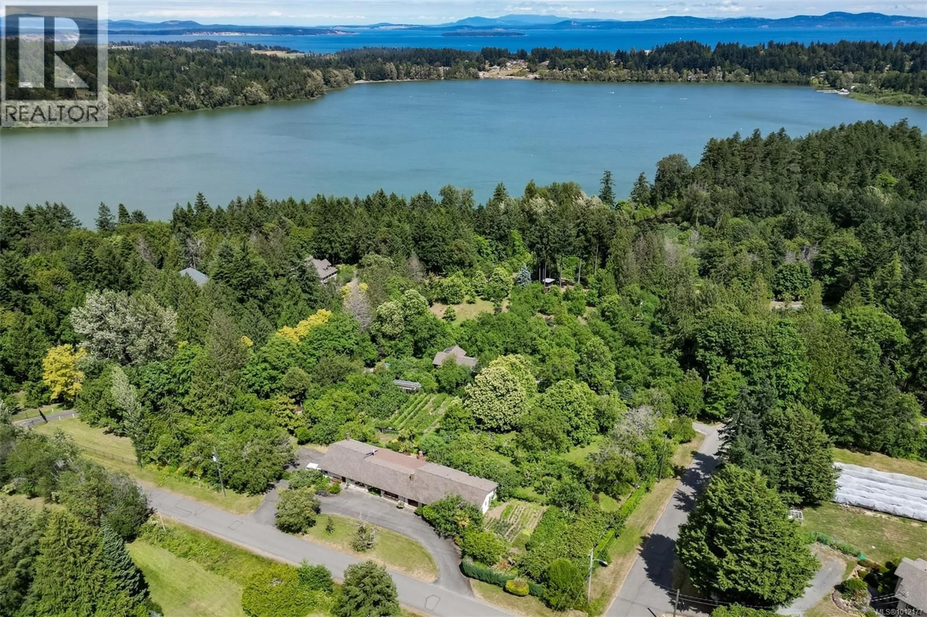 A pic from outside/outdoor area/front of a property/back of a property/a pic from drone, water/lake/river/ocean view for 5489 FOREST HILL ROAD, Saanich British Columbia V9E2A8
