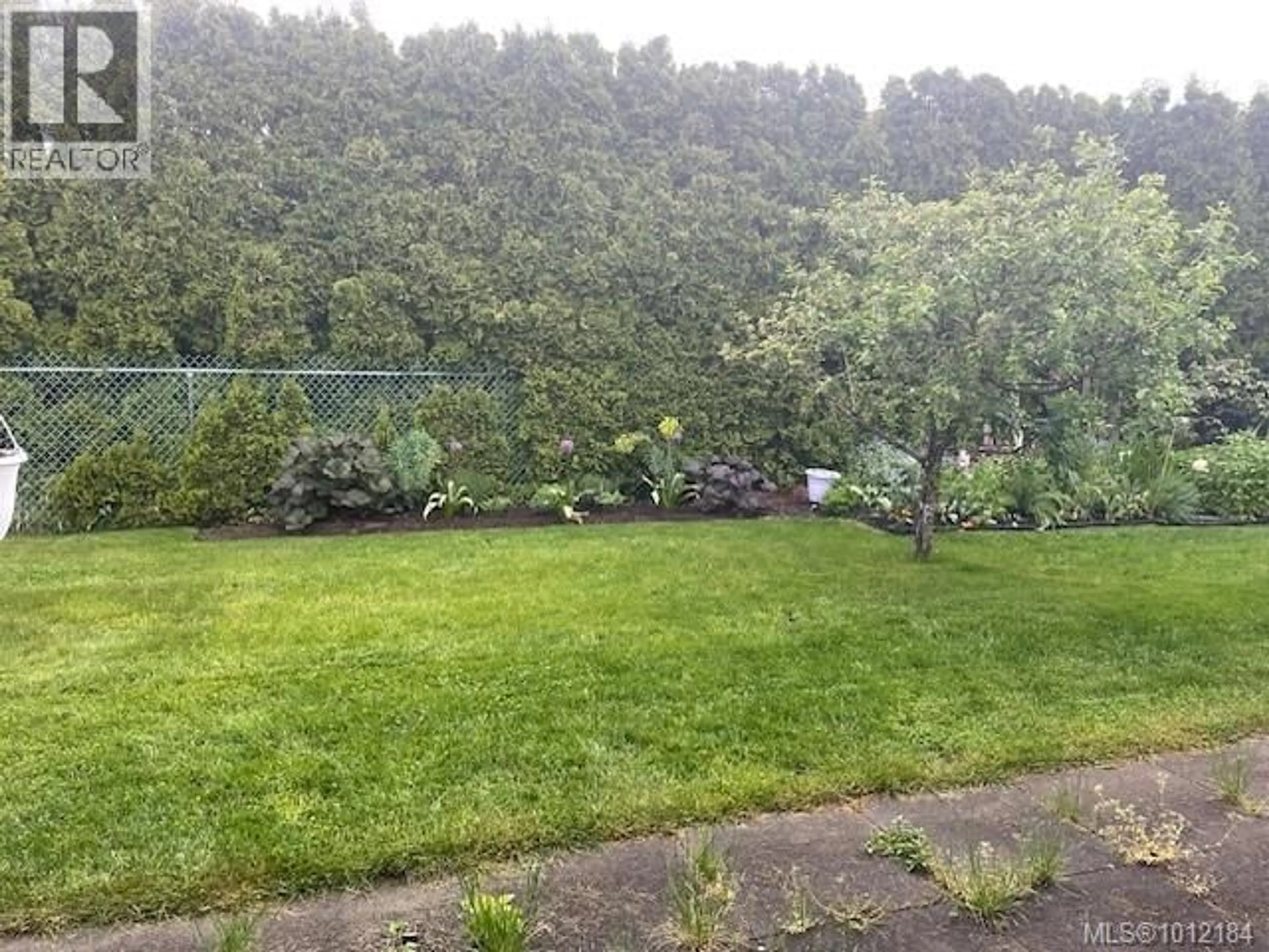 A pic from outside/outdoor area/front of a property/back of a property/a pic from drone, forest/trees view for 210 - 1537 NOEL AVENUE, Comox British Columbia V9M3H8