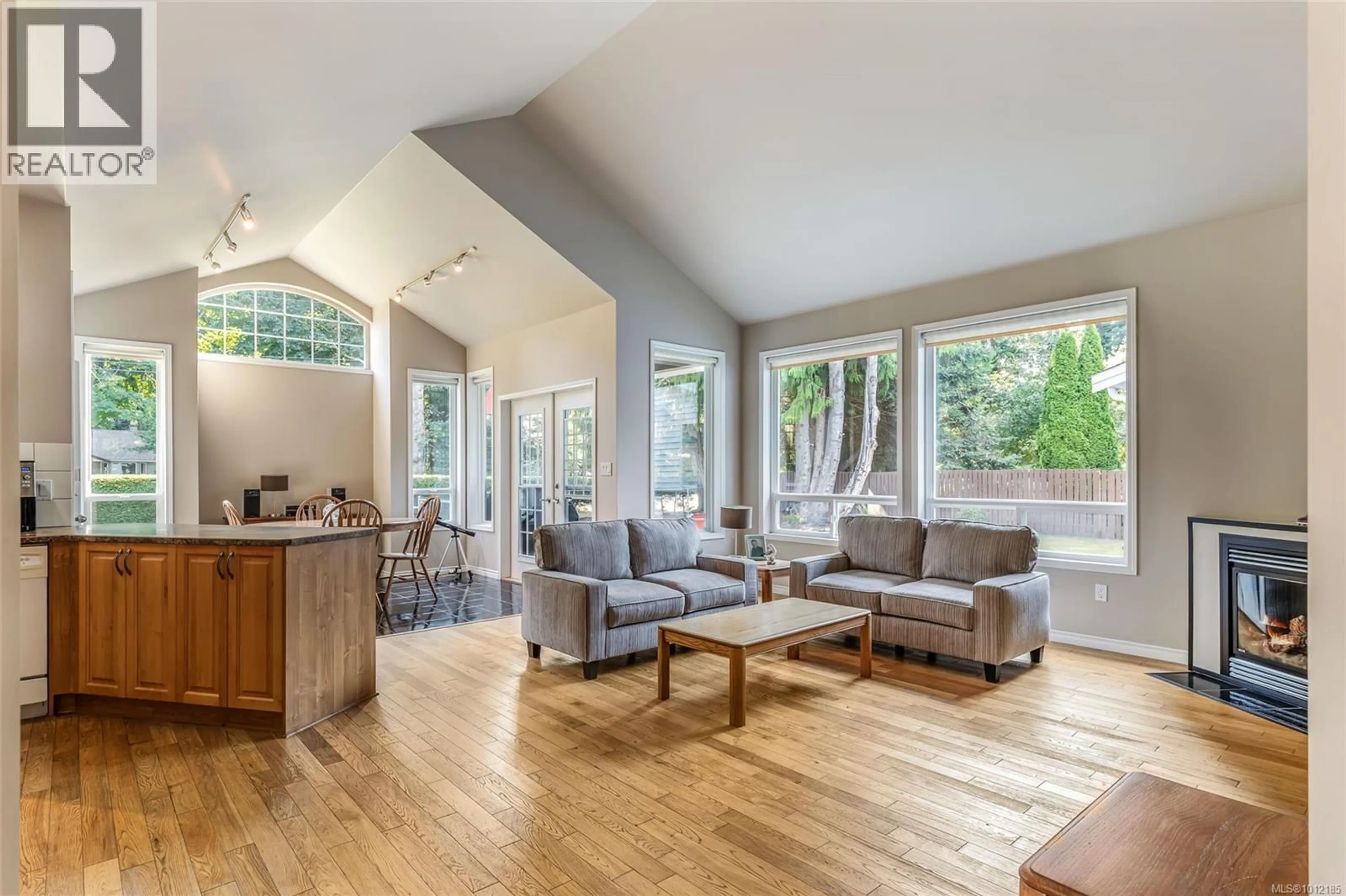 Living room with furniture, wood/laminate floor for 1077 FORGOTTEN DRIVE, Parksville British Columbia V9P1T2
