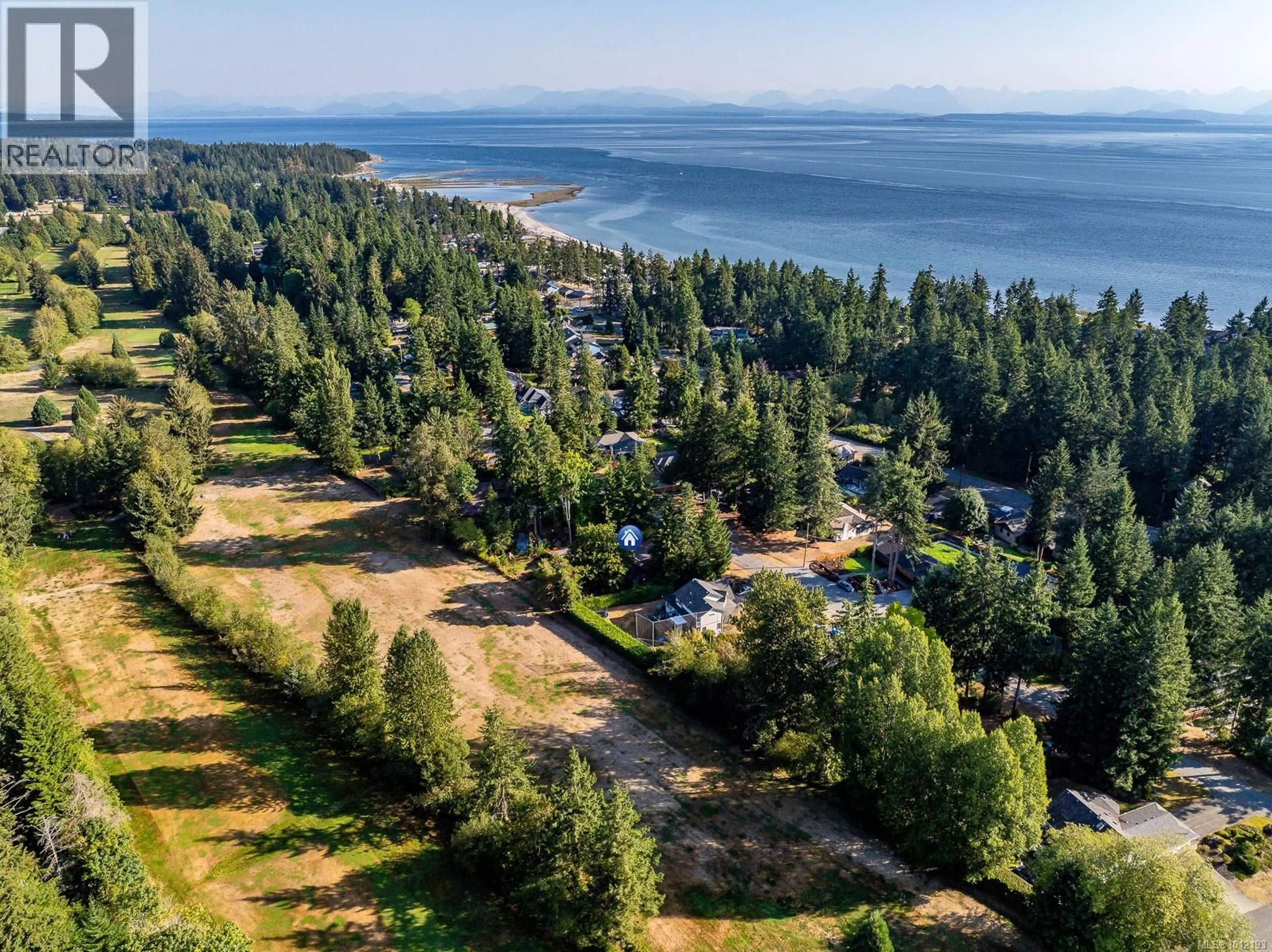 A pic from outside/outdoor area/front of a property/back of a property/a pic from drone, water/lake/river/ocean view for 8837 HENDERSON AVENUE, Black Creek British Columbia V9J1A6