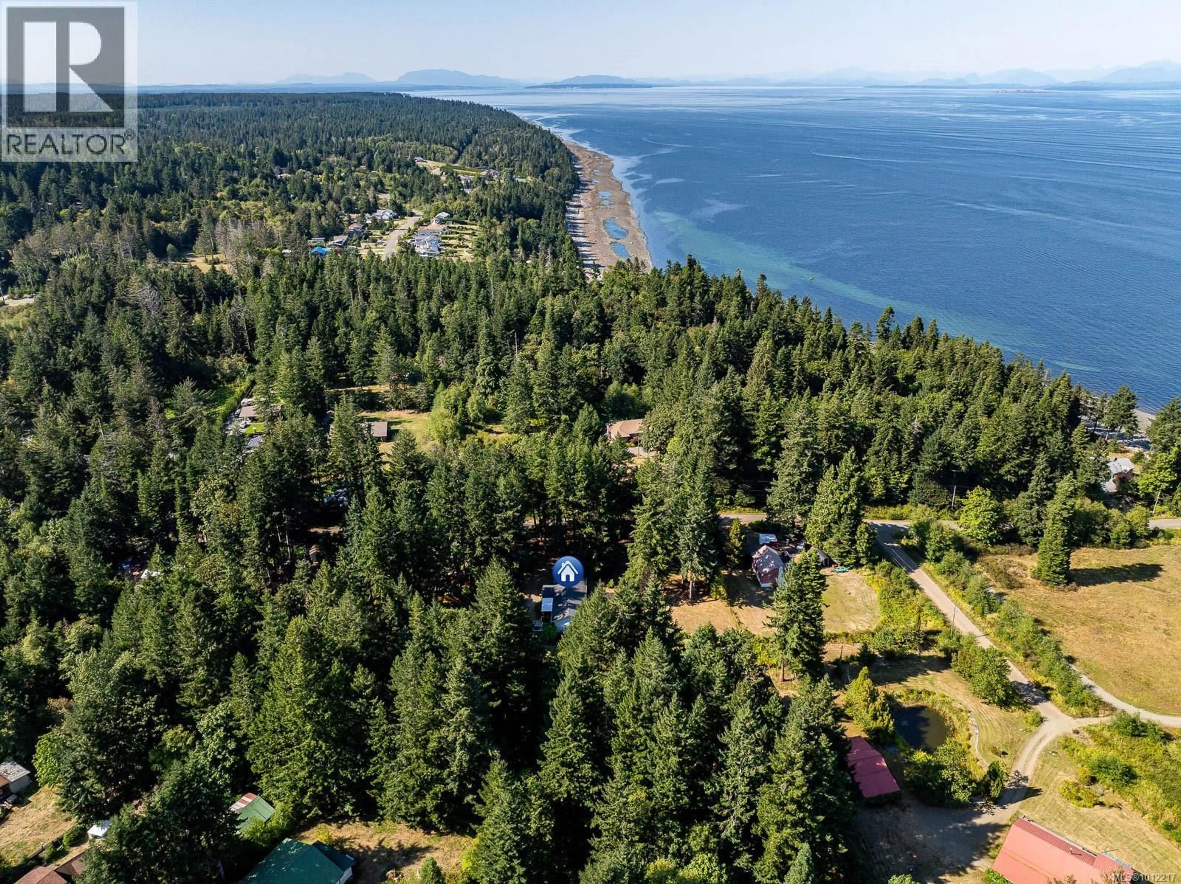 A pic from outside/outdoor area/front of a property/back of a property/a pic from drone, water/lake/river/ocean view for 1927 WILSON ROAD, Courtenay British Columbia V9J1V6