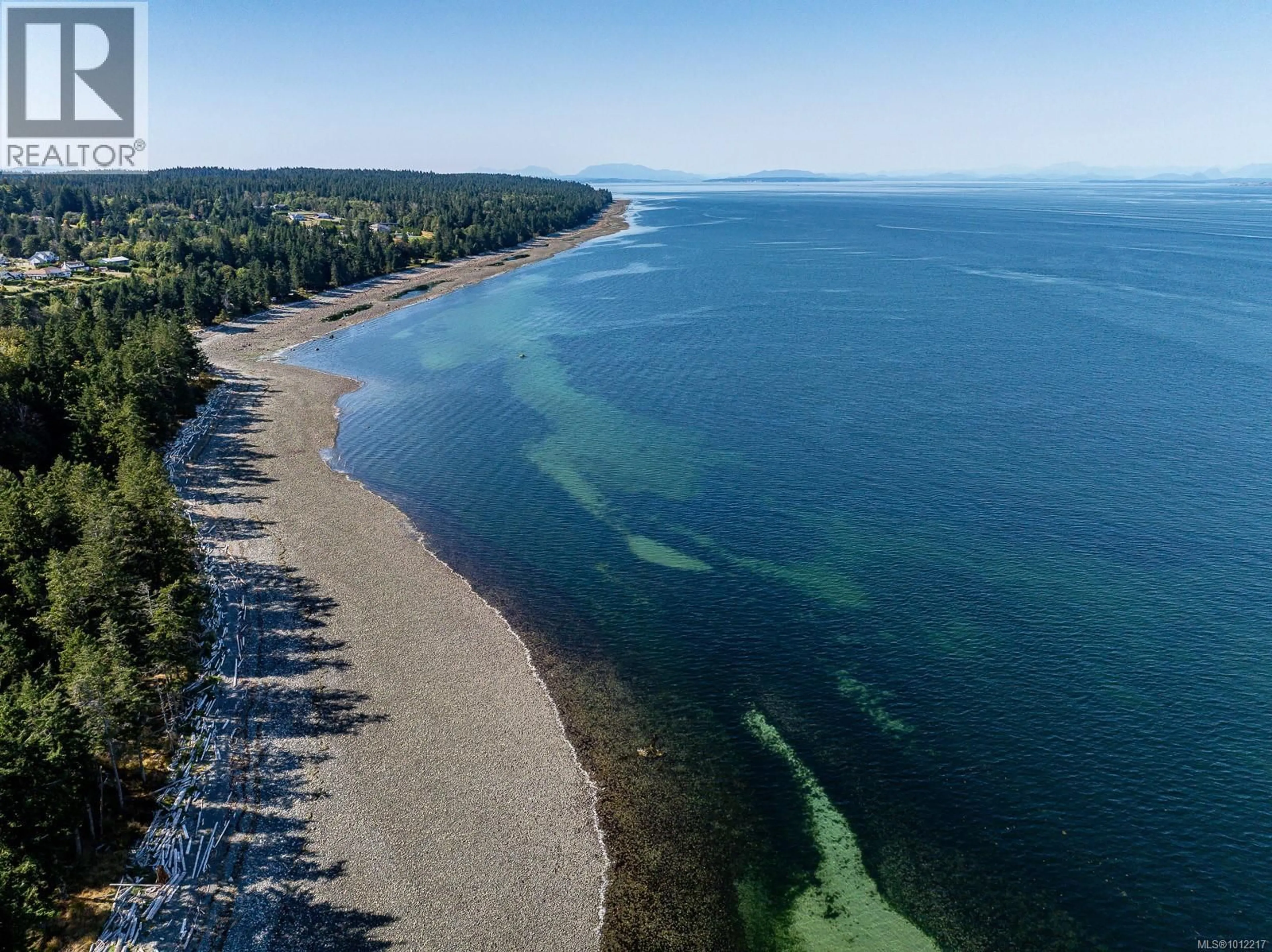 A pic from outside/outdoor area/front of a property/back of a property/a pic from drone, water/lake/river/ocean view for 1927 WILSON ROAD, Courtenay British Columbia V9J1V6