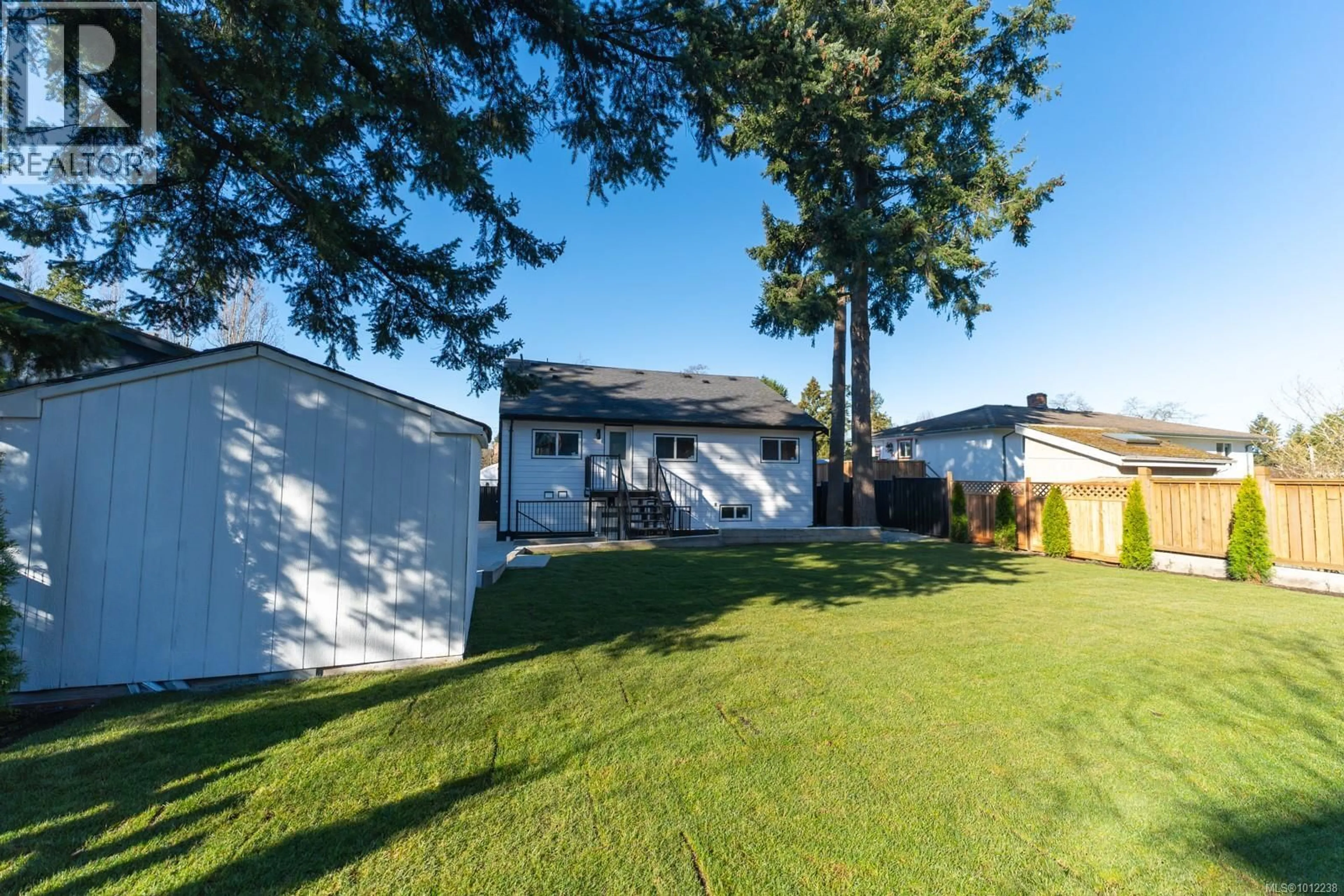 A pic from outside/outdoor area/front of a property/back of a property/a pic from drone, street for 4037 LAKEHILL PLACE, Saanich British Columbia V8X2J6