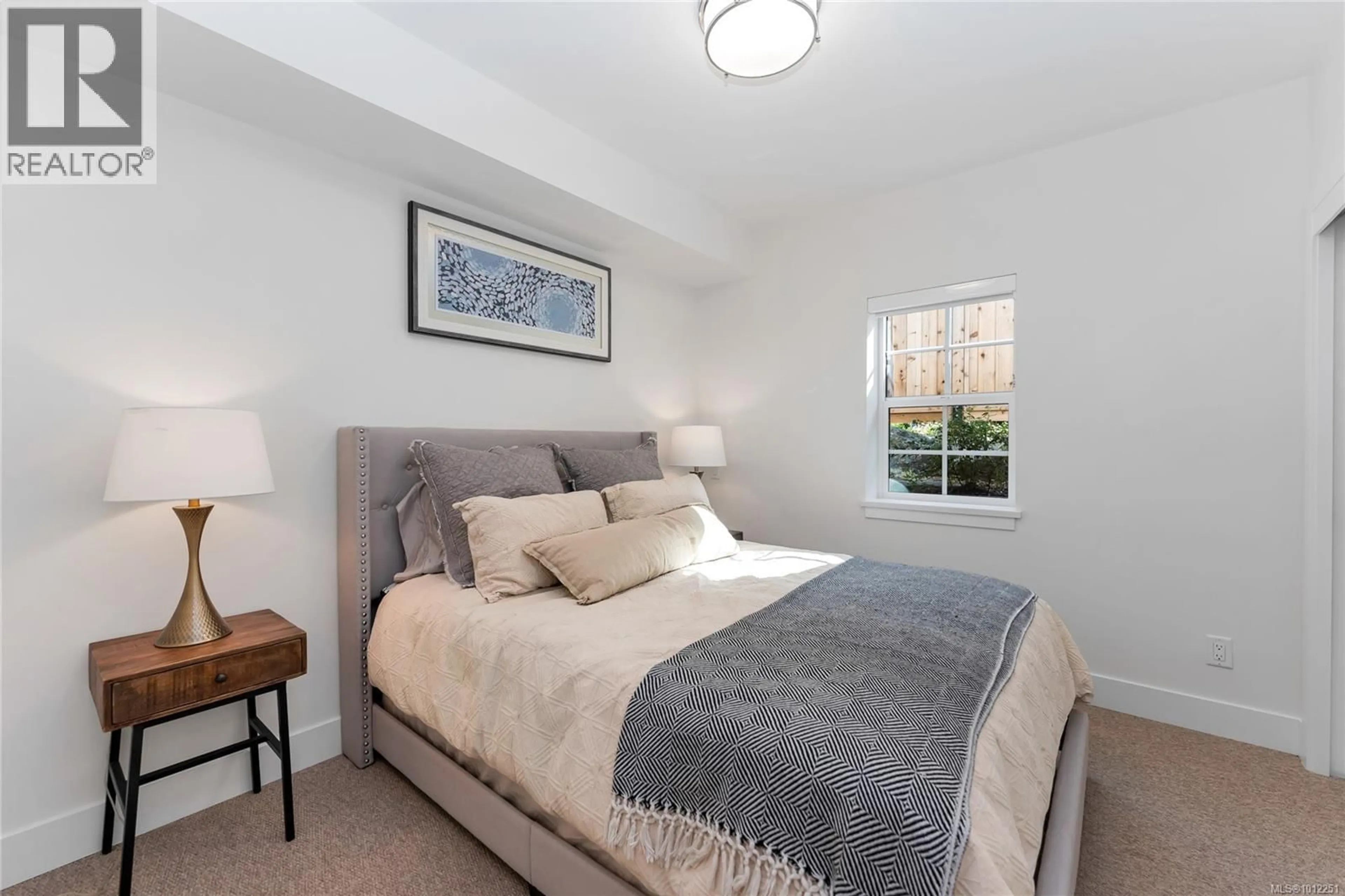 Bedroom with bed, carpet floor for 103 B - 1224 RICHARDSON STREET, Victoria British Columbia V8V3E1